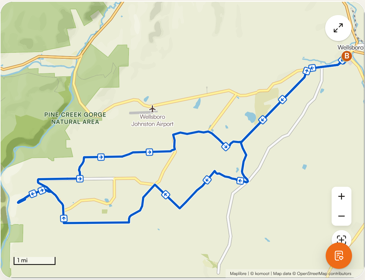 Map showing a route from Wellsboro to Wellsboro B, passing through Pine Creek Gorge Natural Area and Wellsboro Johnston Airport with various turns and blue directional arrows.