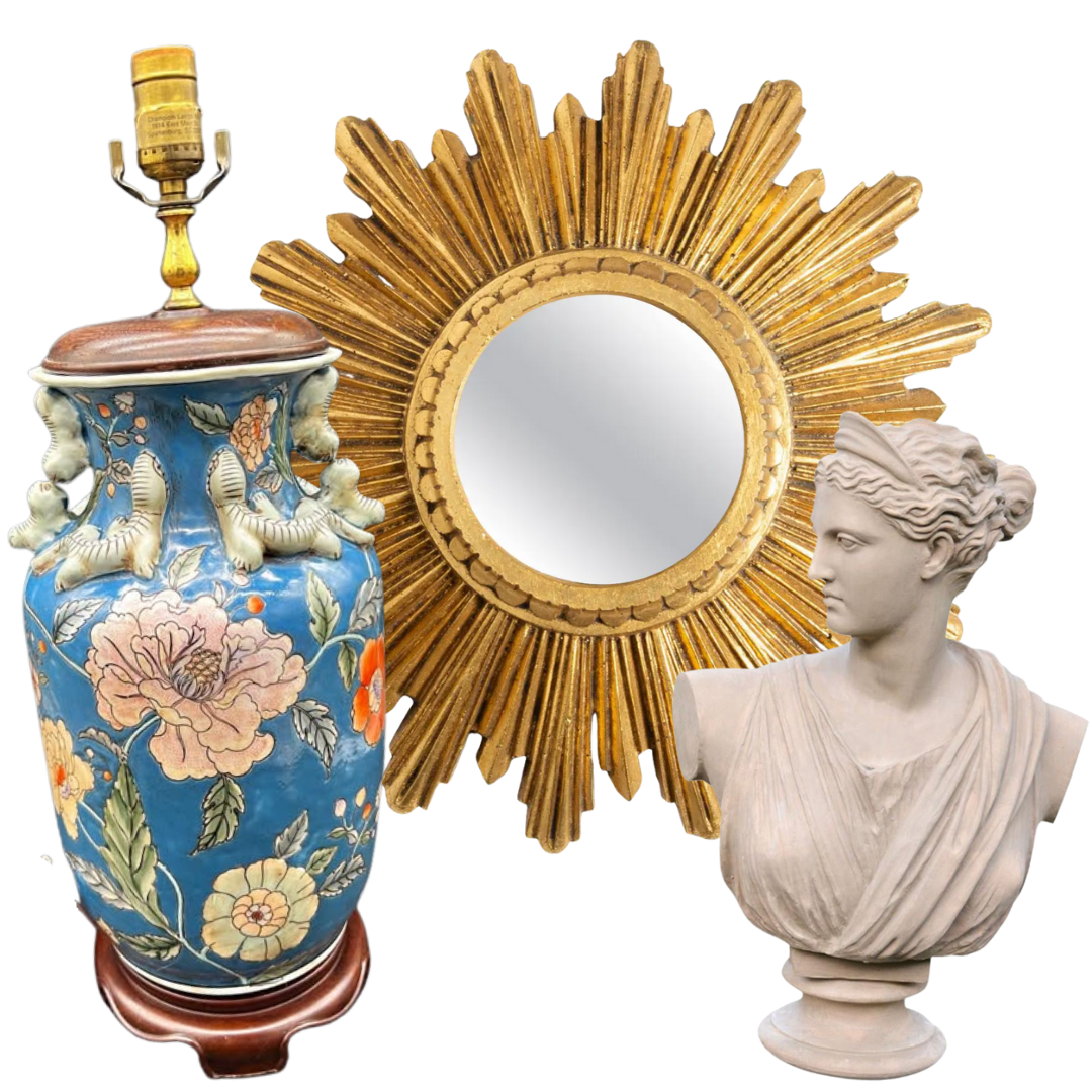 Decorative items including a blue floral ceramic vase, a gold sunburst mirror, and a white classical bust sculpture