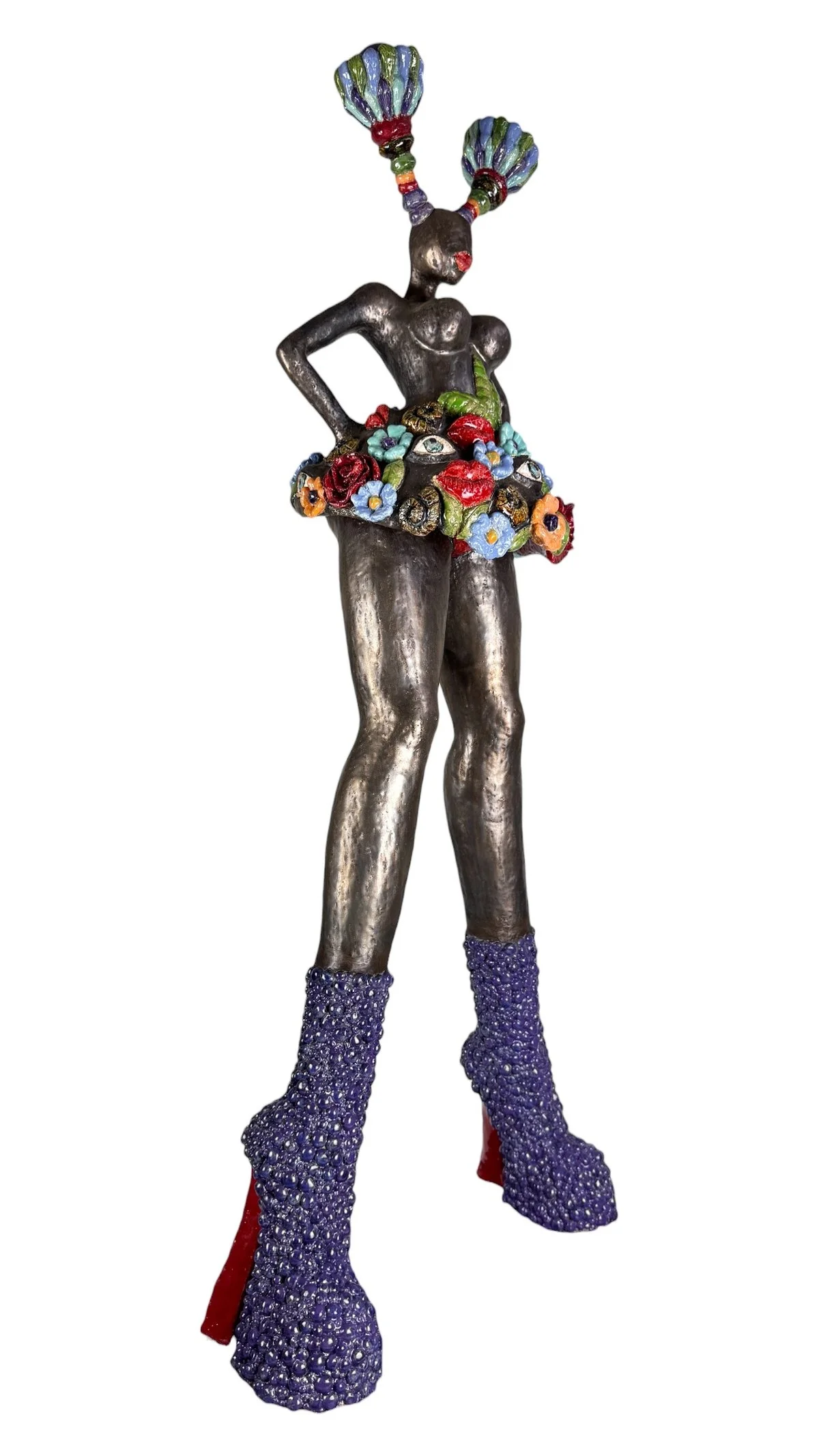 ceramic sculpture, with flowers, eyes, shells and lips. Contemporary,high purple boots, horns
