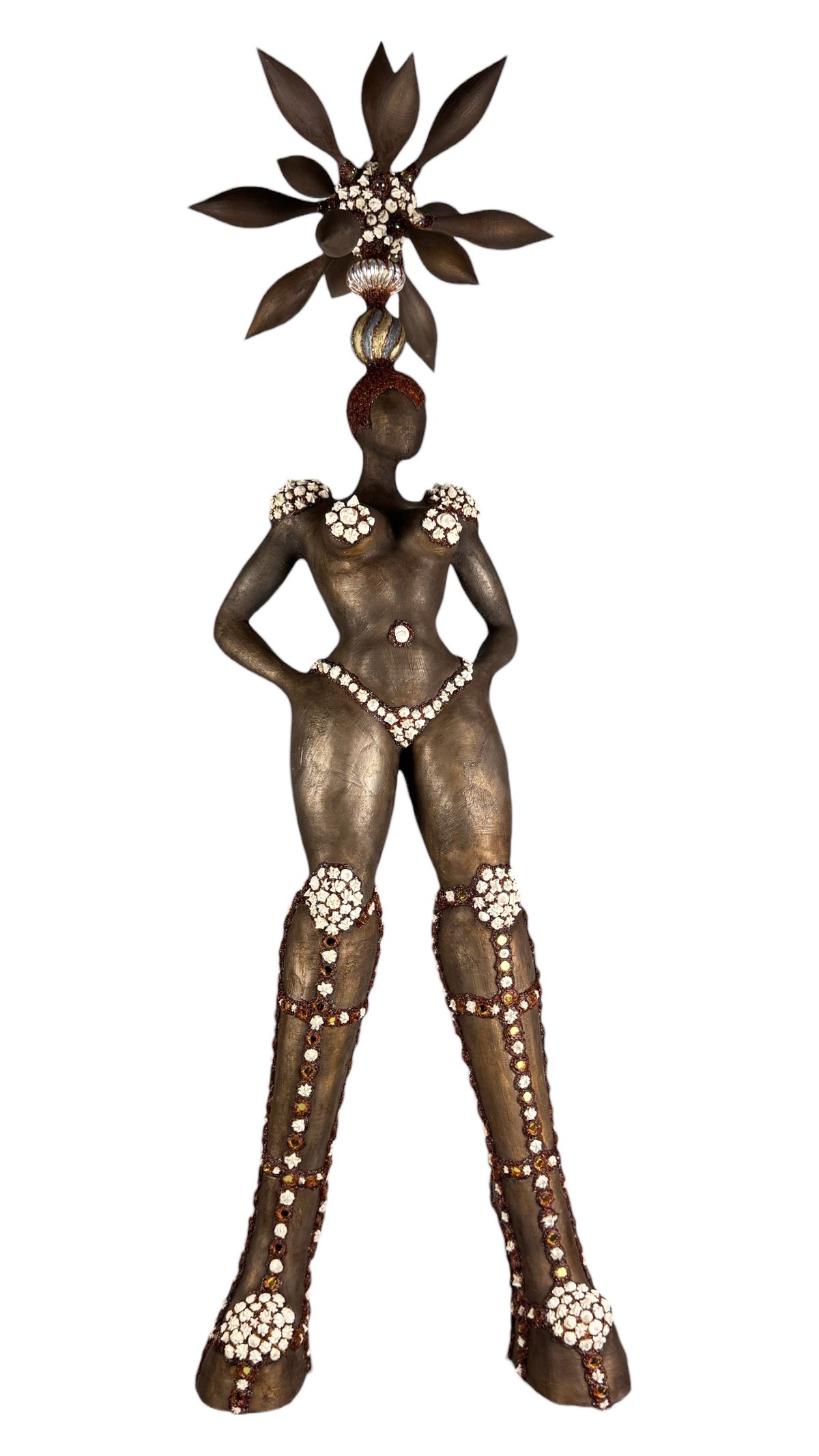 figurative sculpture of a powerful woman in plateau boots with cream puff like ornaments and baraque headpeace