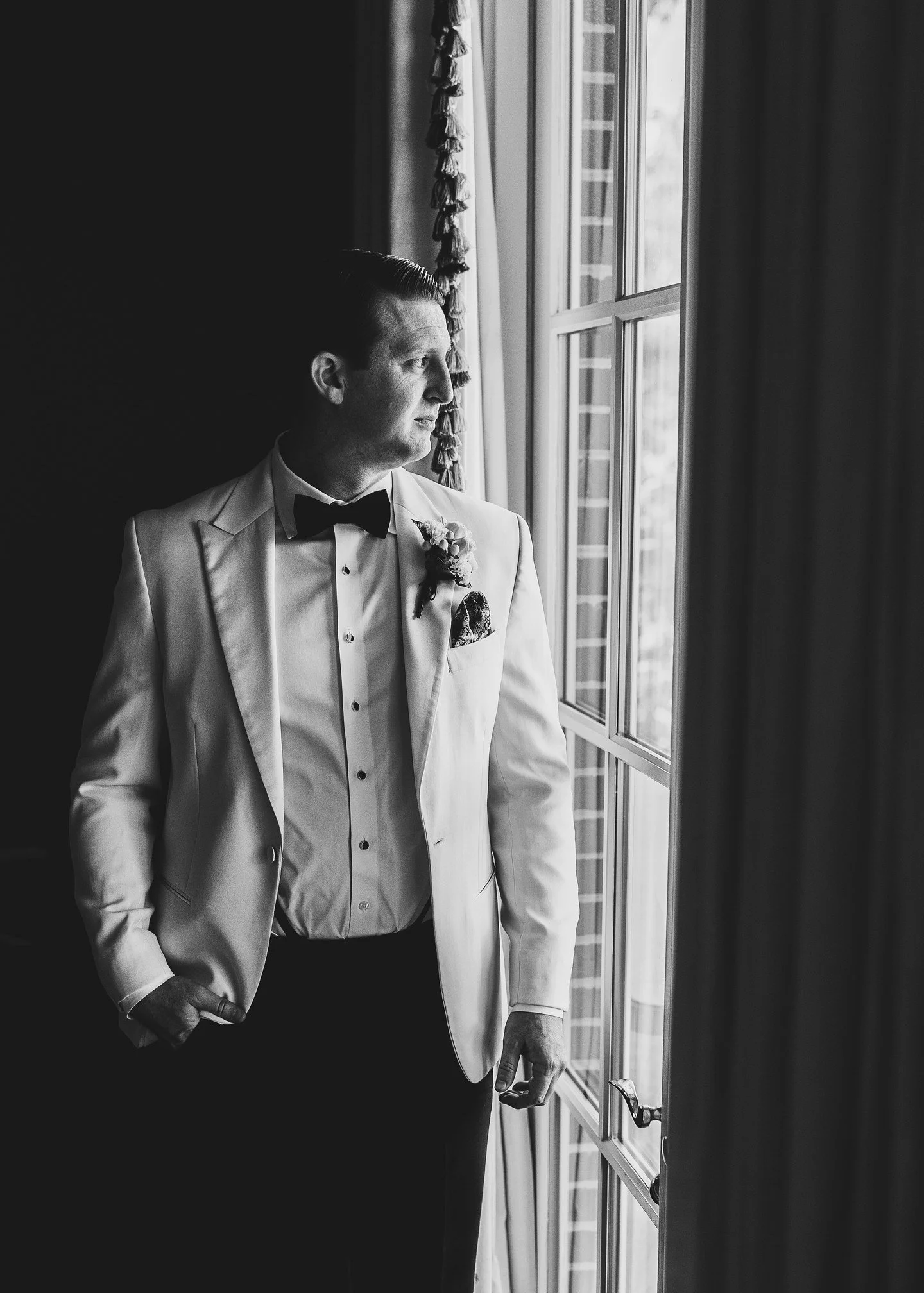 A cinematic pause. 

Clean composition and intentionally-directional light lend a refined, sculptural feel.

I never want a man to feel like a supporting actor on his wedding day.

This frame took only a moment to make&mdash;but it might be the image