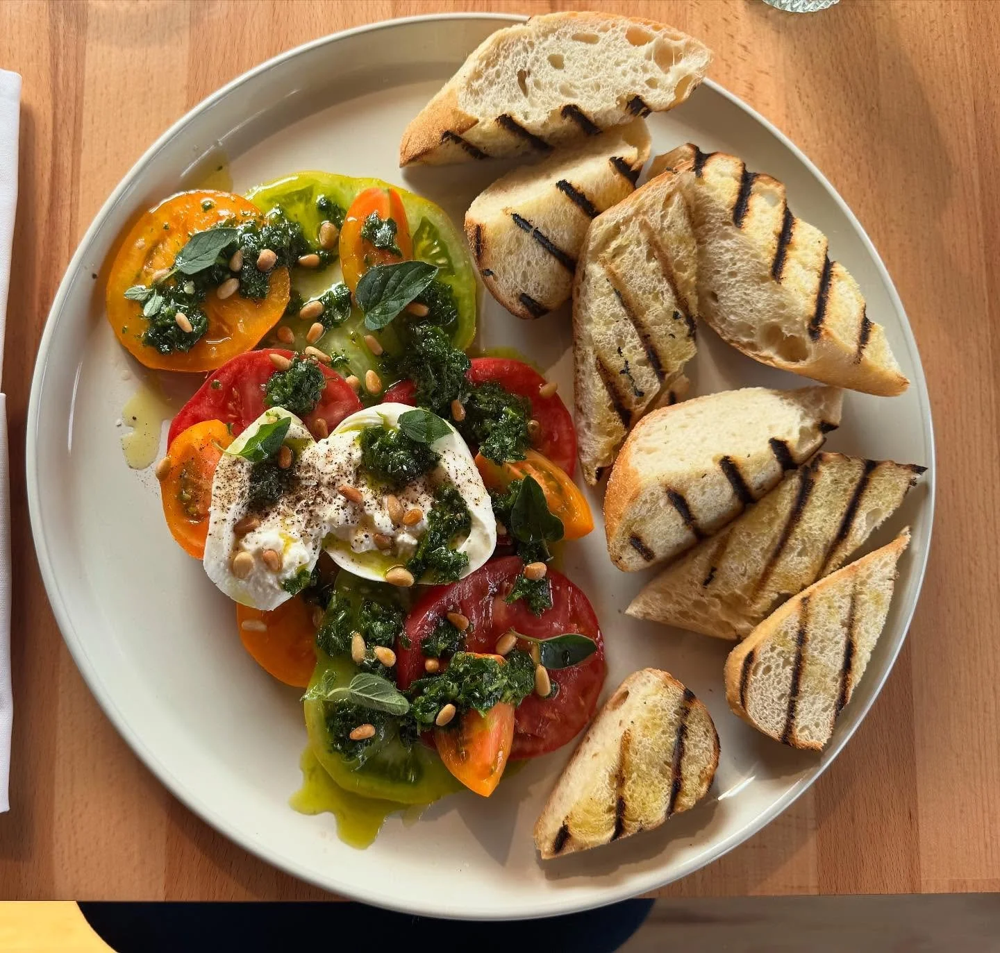 ✨New on the menu!✨

Meet The Jewel from the Farm &mdash; Bryndlewood Gardens heirloom tomatoes stacked with creamy burrata, toasted pine nuts, zesty gremolata, a mist of sherry vinegar, and grilled bread on the side for soaking up every last drop.

P