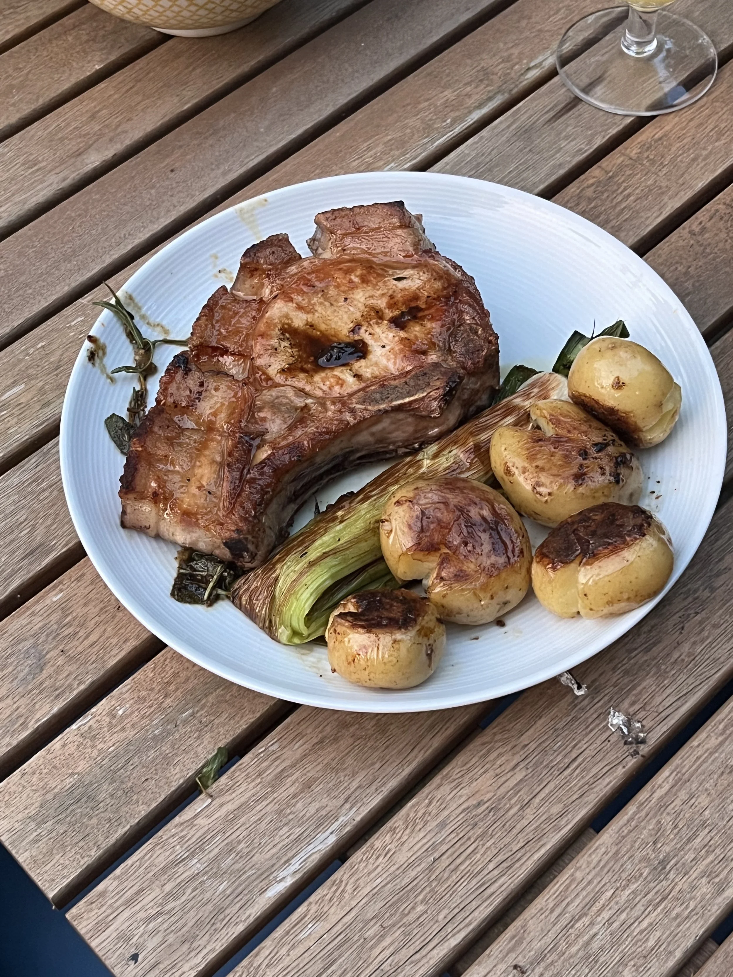 Roasted pork with golden potatoes and leek—one of many nourishing retreat meals enjoyed in Tinos