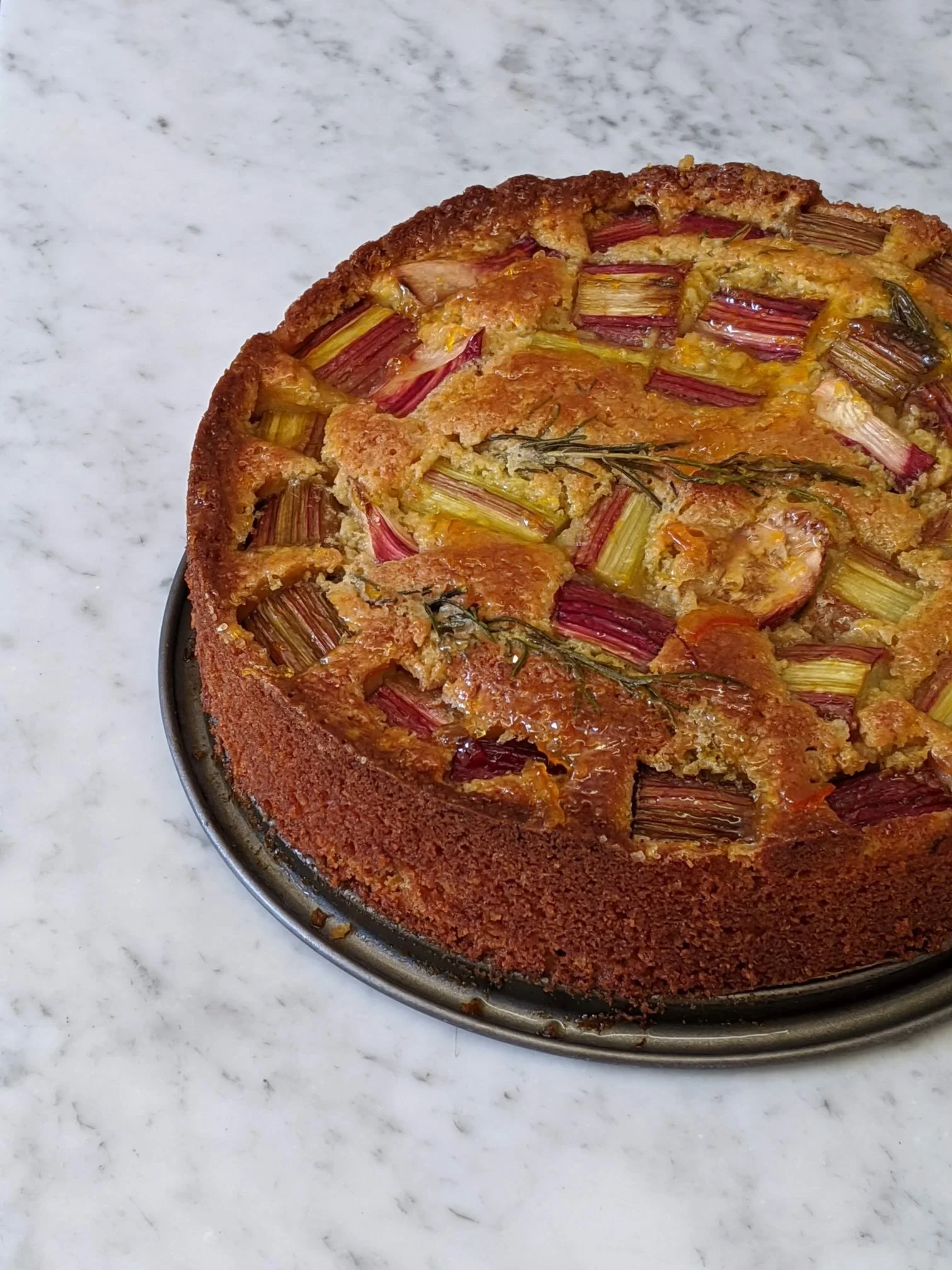 Golden-brown rhubarb crisp fresh from the oven, served as a seasonal sweet treat on retreat