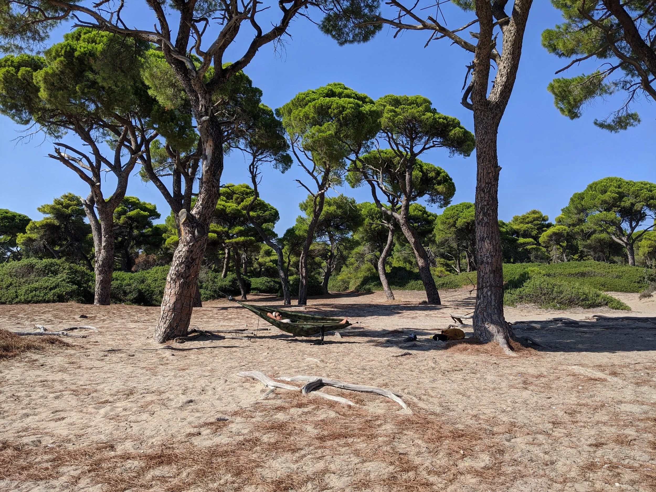 Relaxing in a hammock by the beach under Greek sun—moments of rest woven into every Zengean retreat