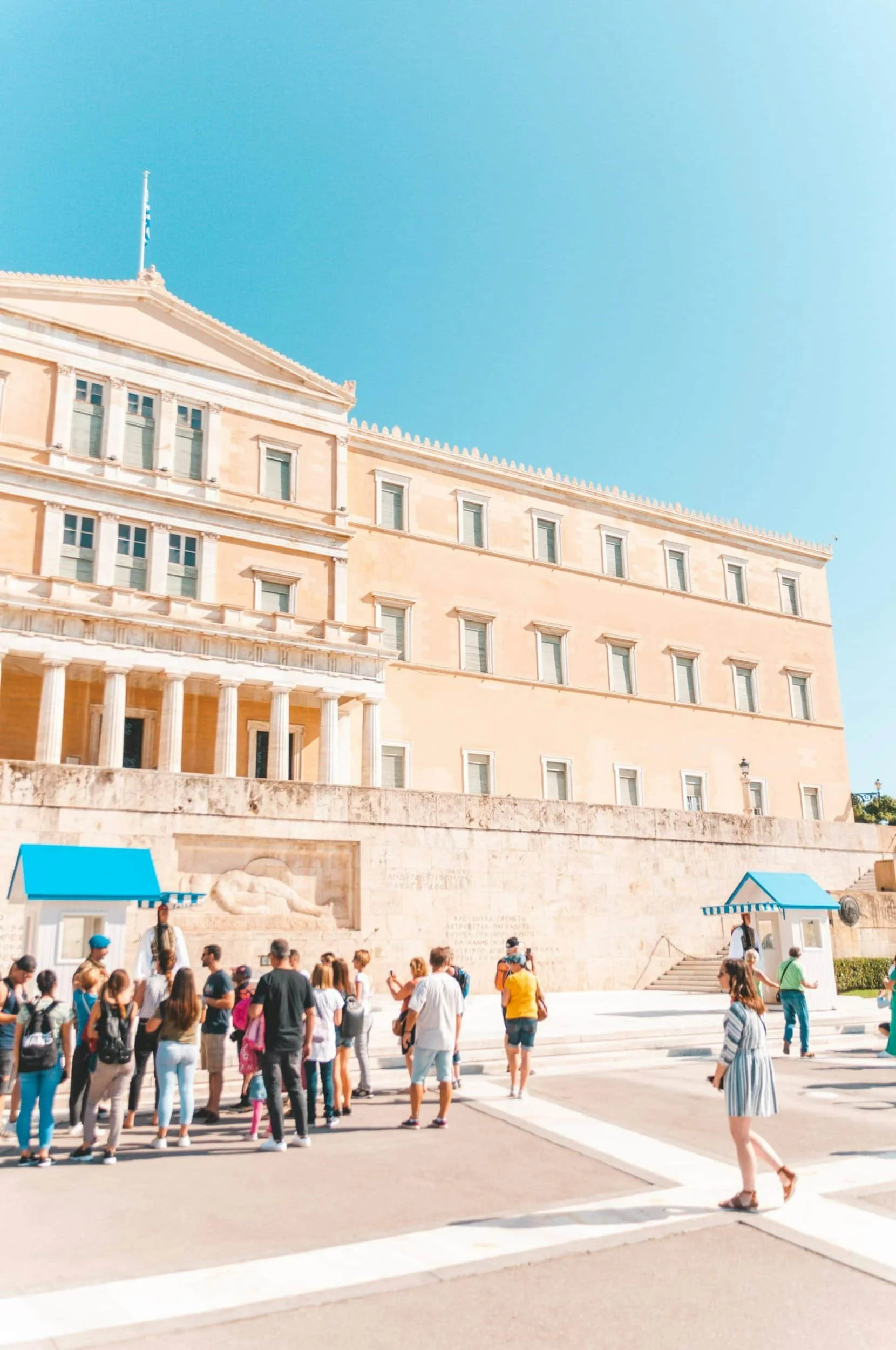 People admiring architecture and sun in Athens