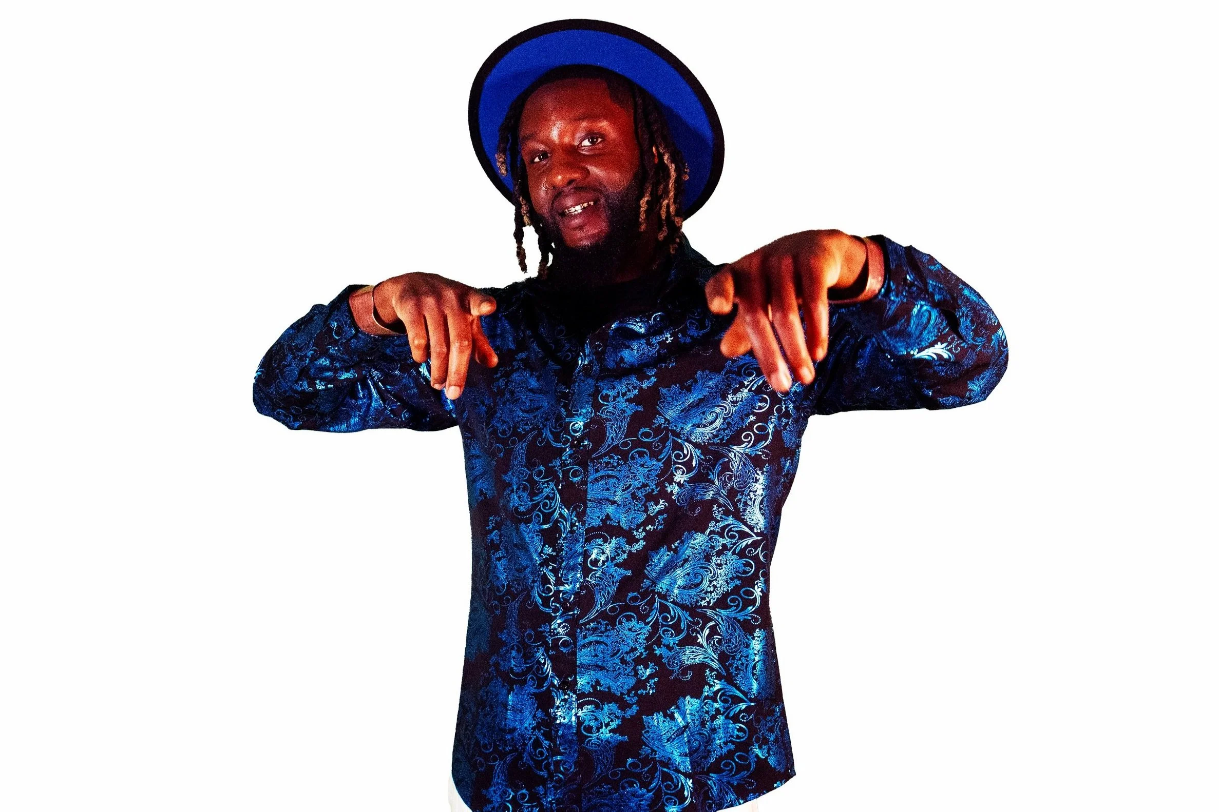 Rob B Beatz wearing a blue patterned shirt and hat