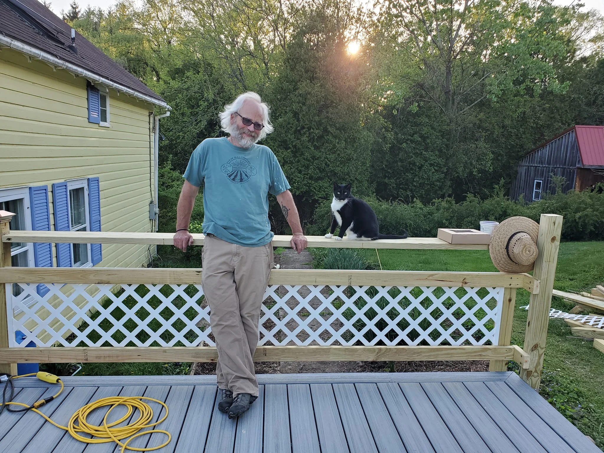 Eric and friend on a deck and railing Eric built.
