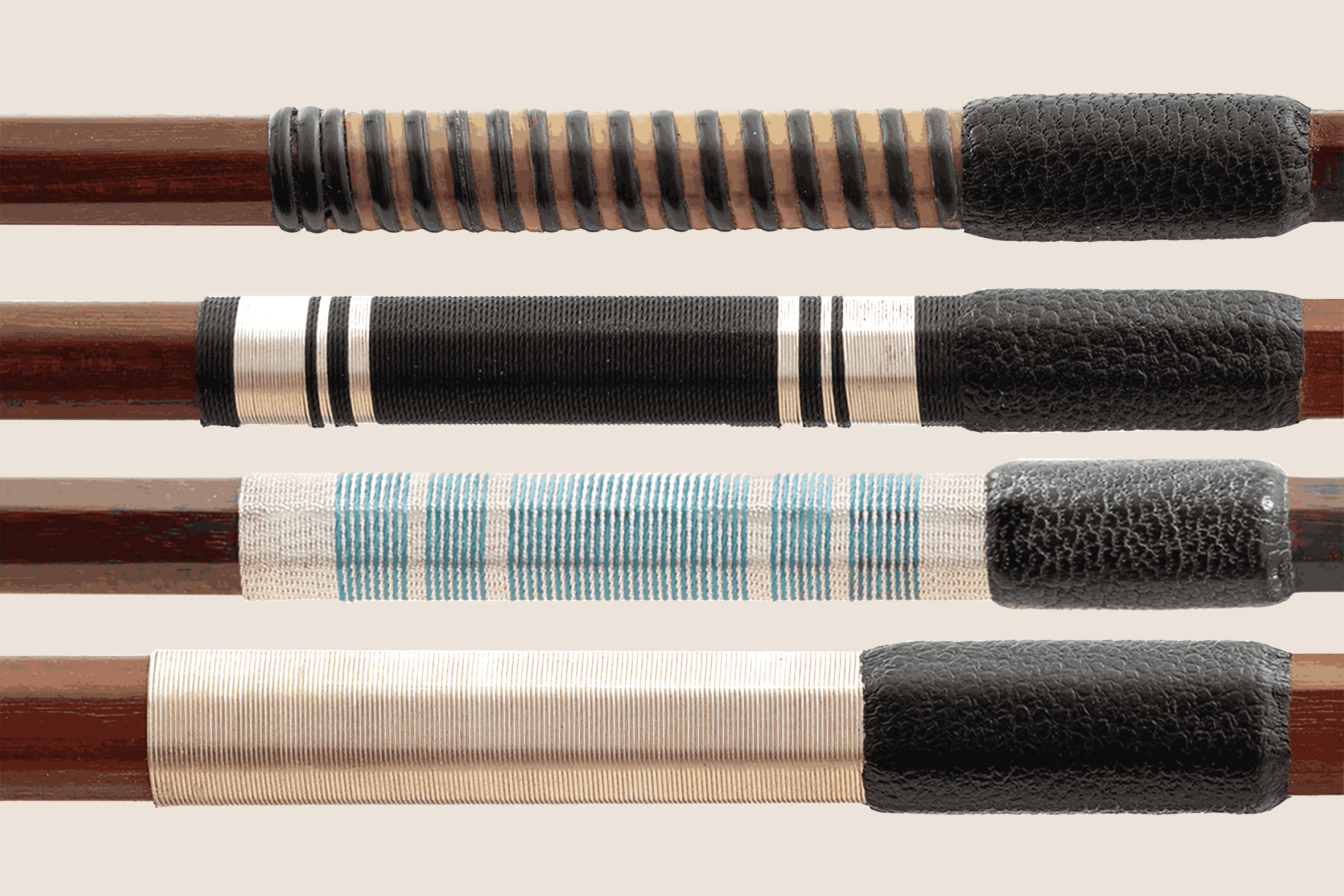 Close-up of four wooden sticks with black and fabric wraps, used as traditional Japanese percussion instruments called 'fuurin' or 'kotsuzumi'.