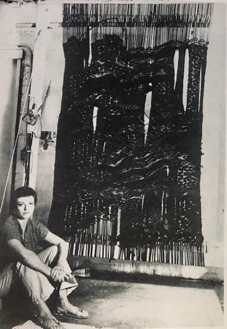 leatrice Linden in fron of weaving art