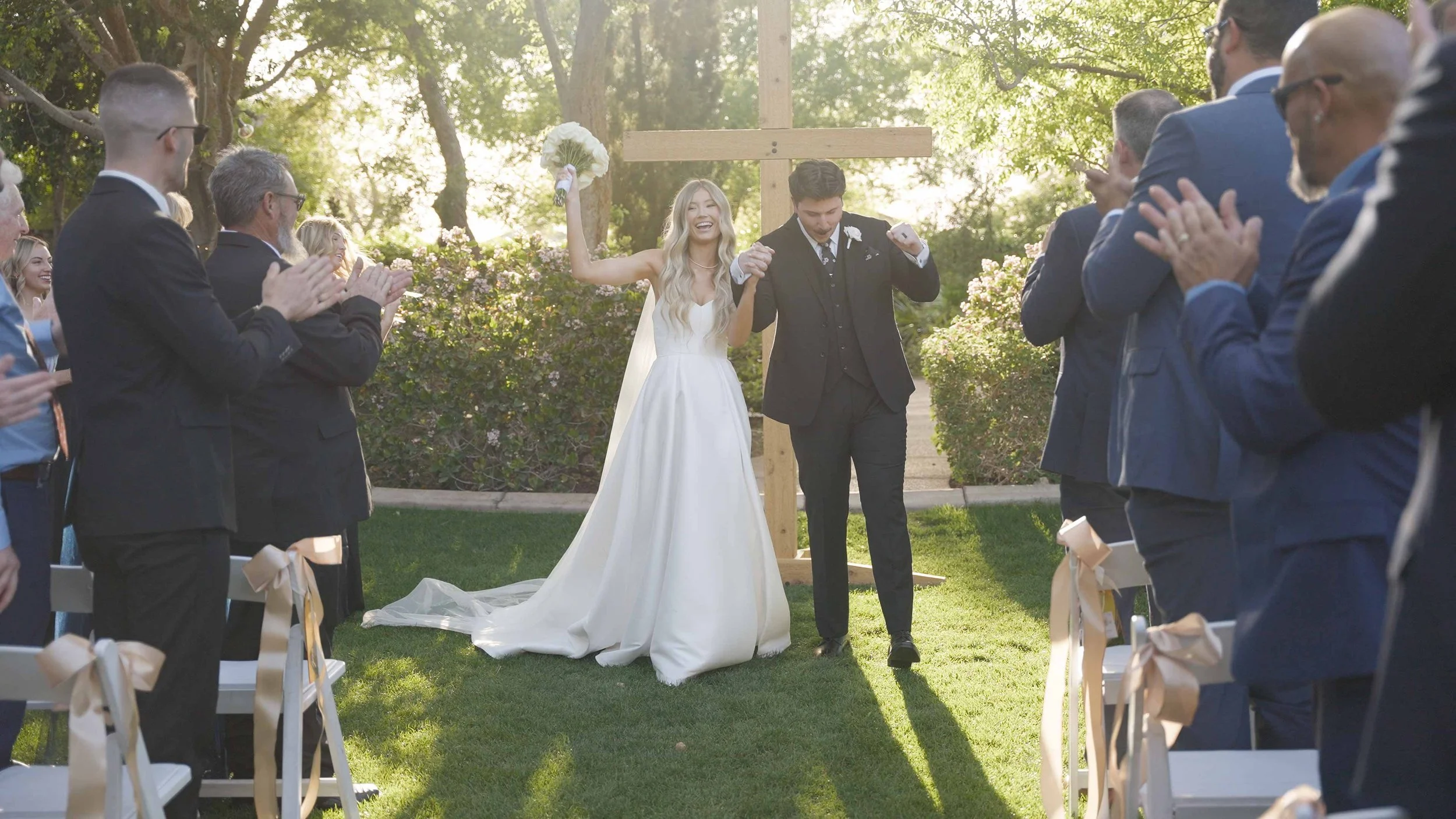 Wedding livestreaming of an outdoor ceremony in the East Valley with guests celebrating the couple