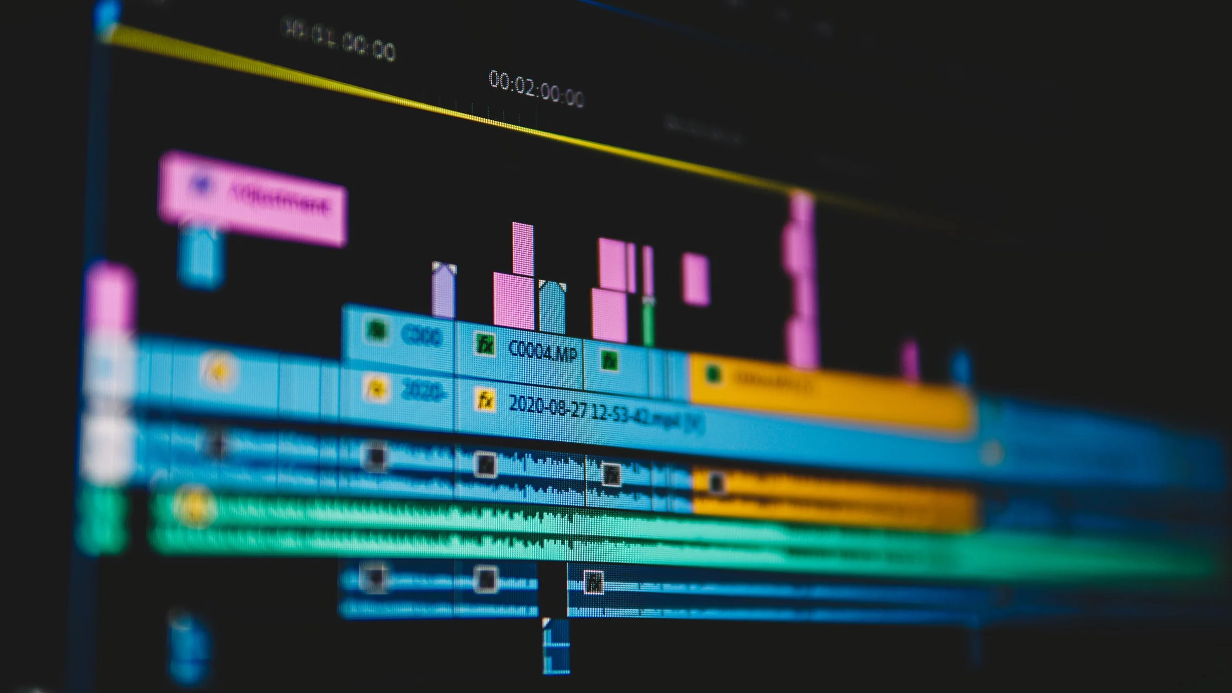 Valley Video editing and animation services. A screenshot of a video editing software timeline with multiple colored tracks, waveforms, and a preview monitor displaying a video project.