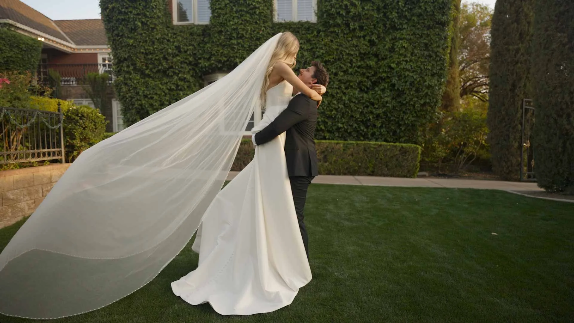 Wedding livestreaming capture of a couple embracing at an East Valley outdoor reception