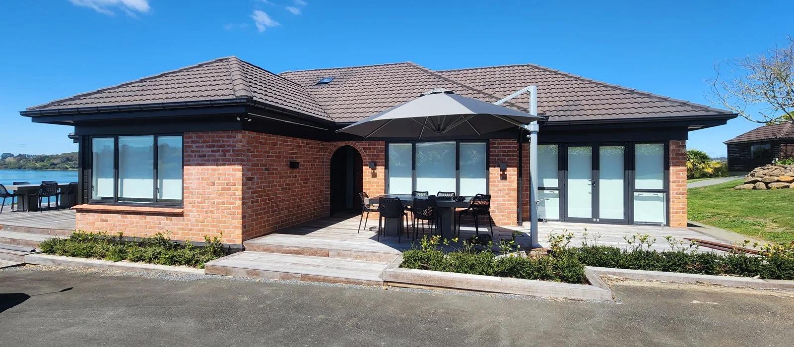 Piwakawaka Lodge_House Entrance and Side Deck.jpg