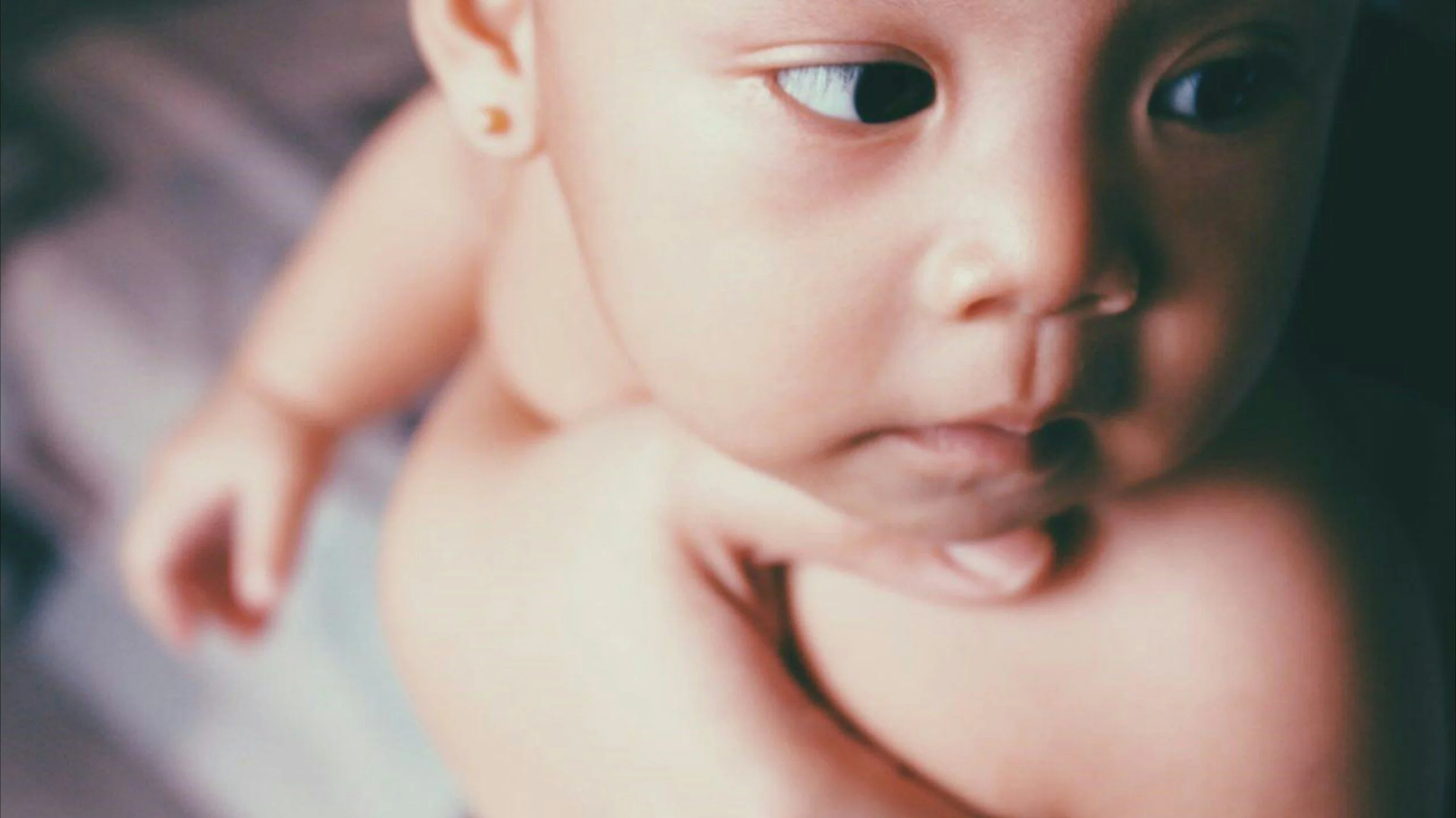 Close-up of a baby's face looking to the side