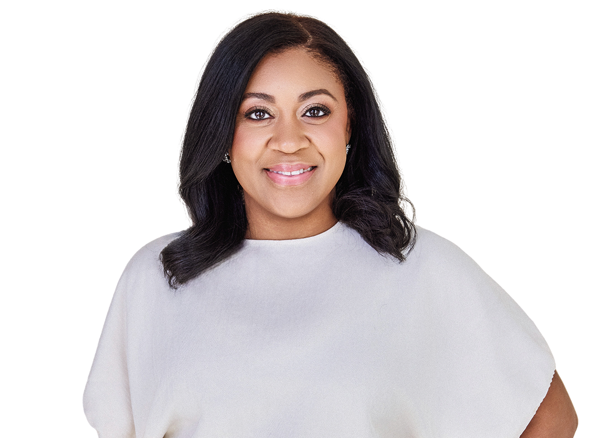 Headshot of a smiling African American woman with shoulder-length black hair, wearing a white top, posing against a plain background.