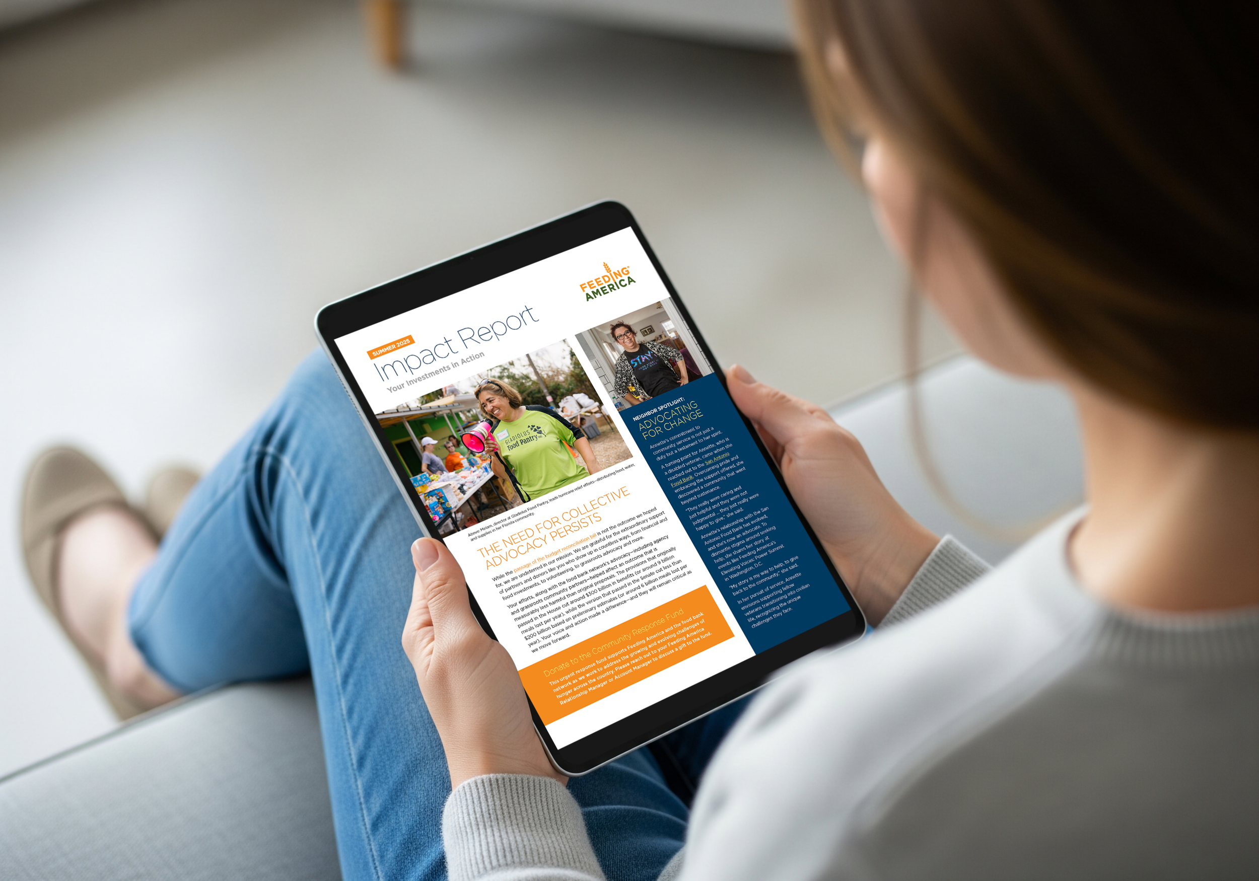 Person sitting on the floor holding a tablet displaying a report titled 'Impact Report' with images of community service activities and text about advocating for change.