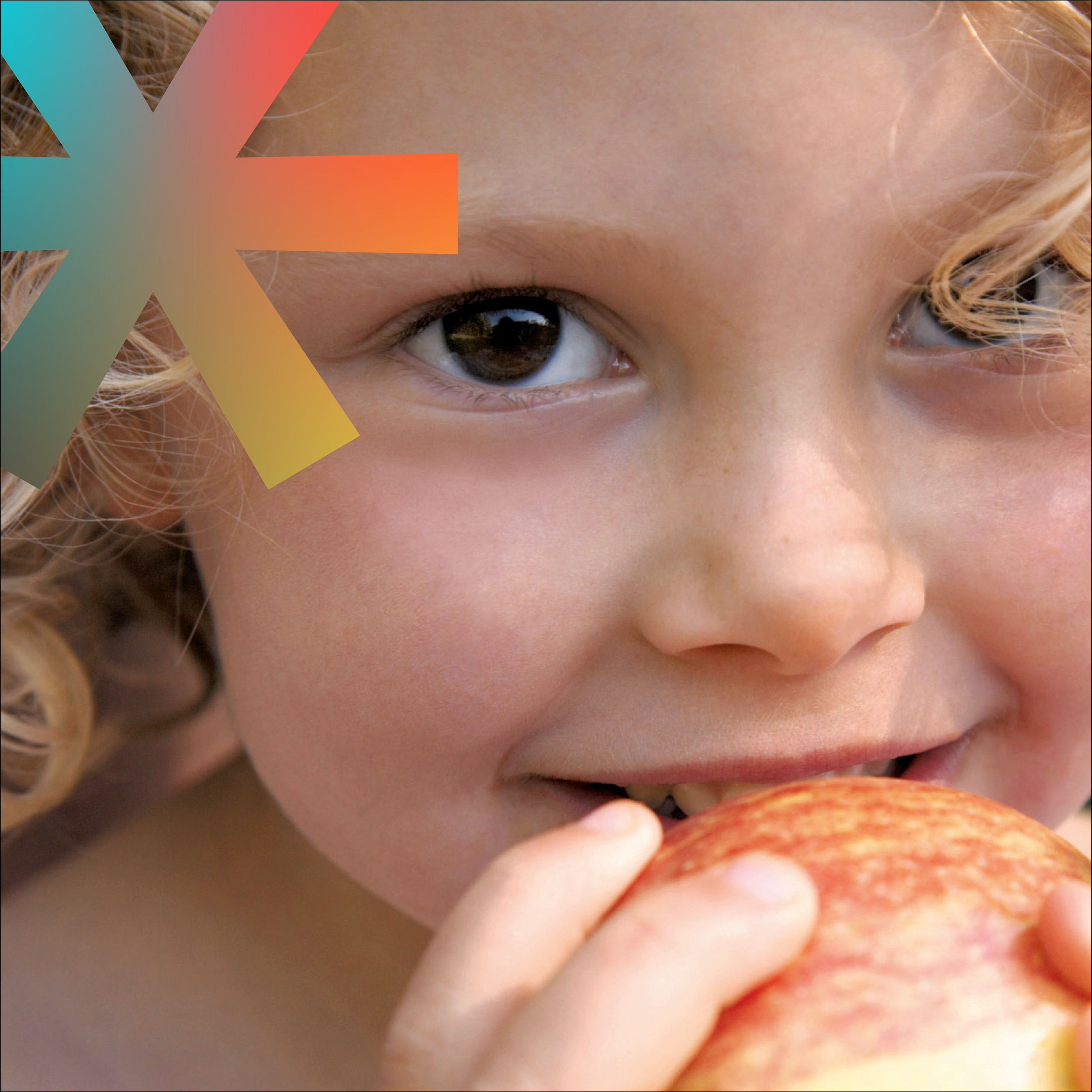 Close-up of a child's face, showing bright brown eyes and curly blonde hair.