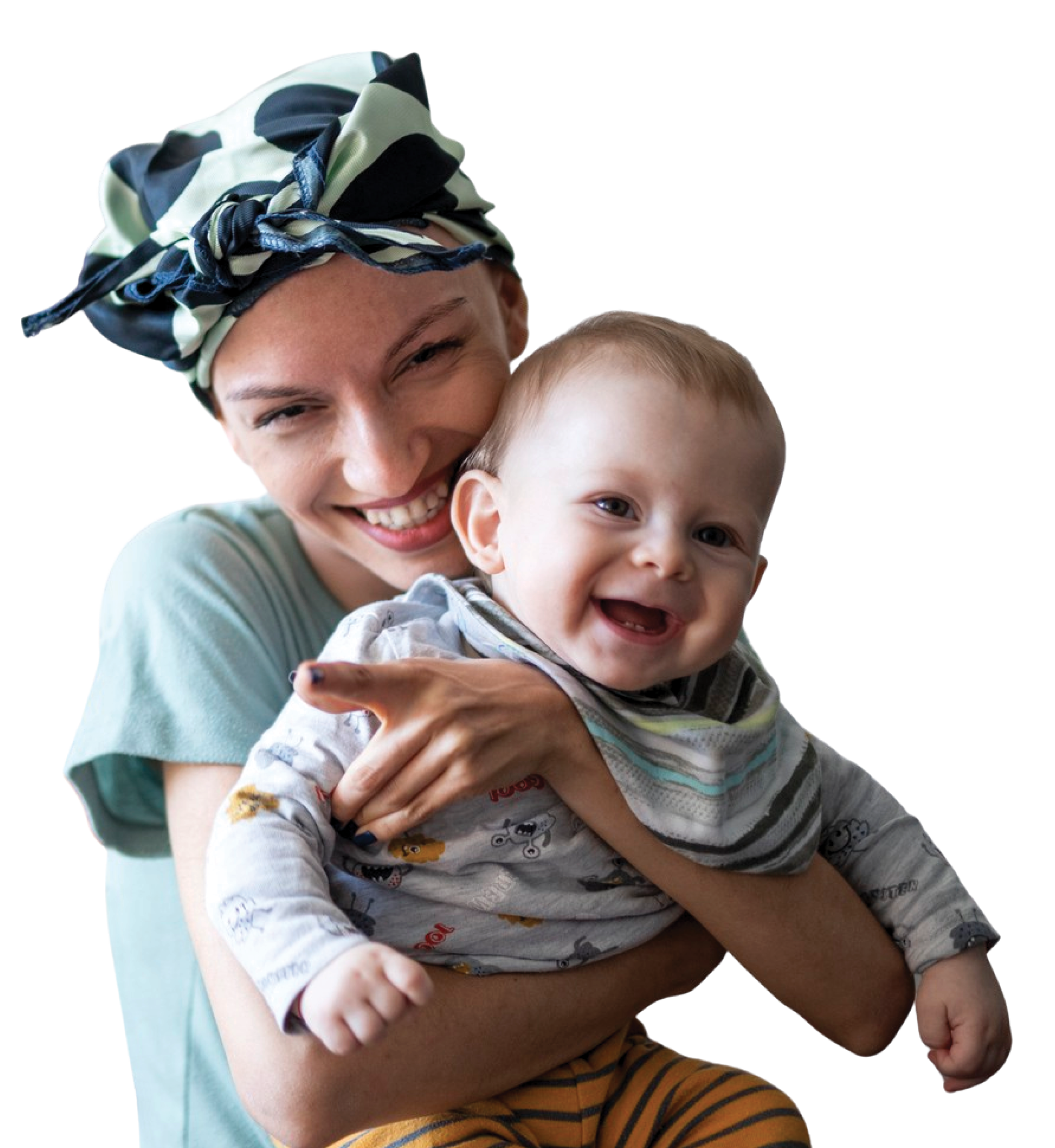A woman with a headscarf and a young child sharing a joyful moment, smiling and close together.