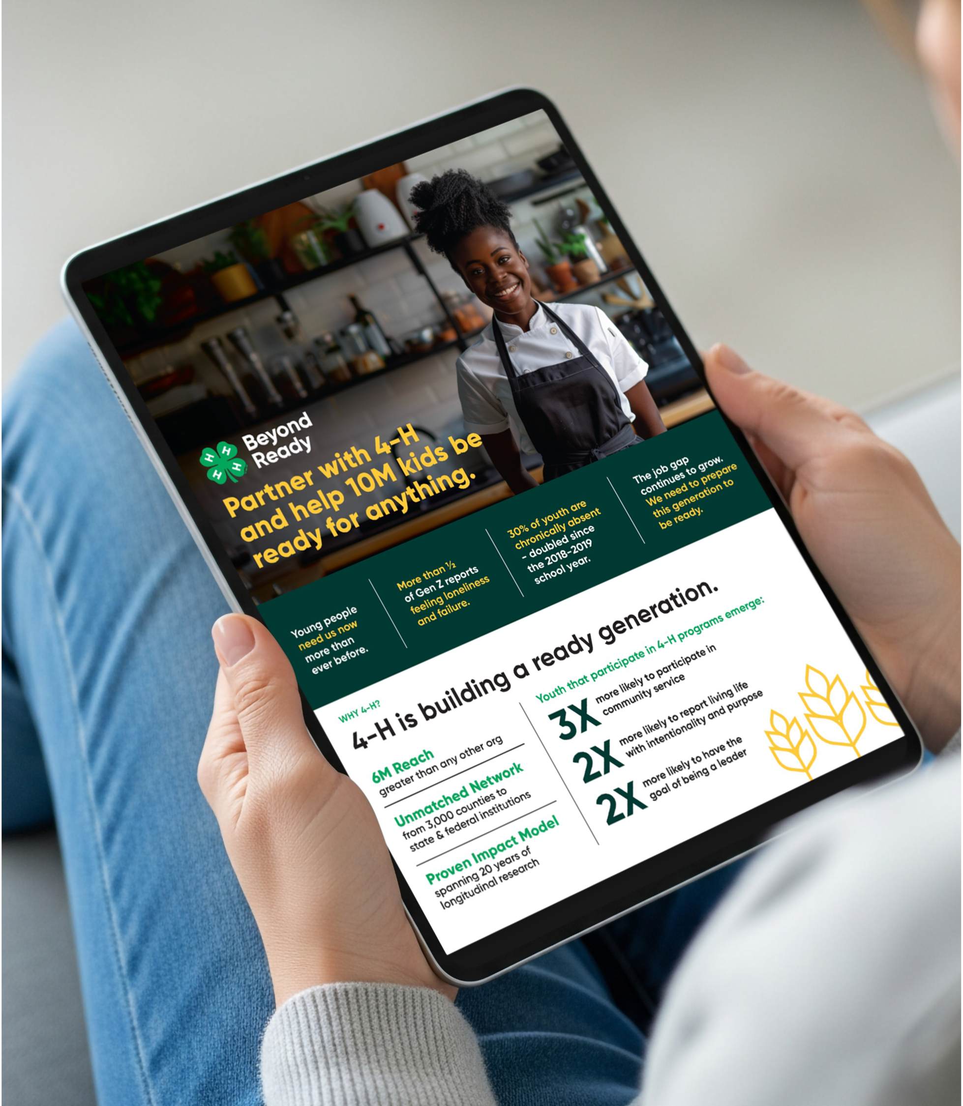 Hand holding a tablet displaying a website about the 4-H youth organization with a smiling African American girl in a chef uniform in the background.