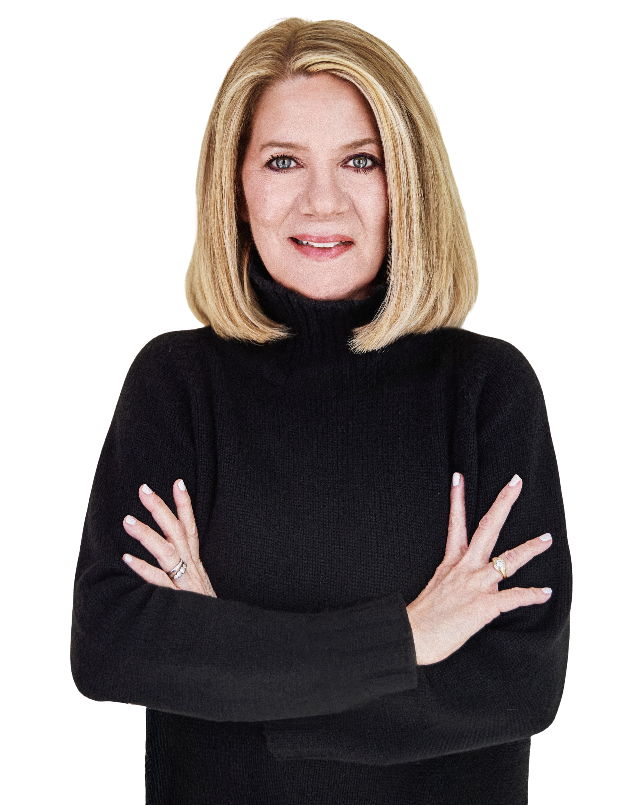A woman with shoulder-length blonde hair, wearing a black turtleneck, with crossed arms and a serious expression.