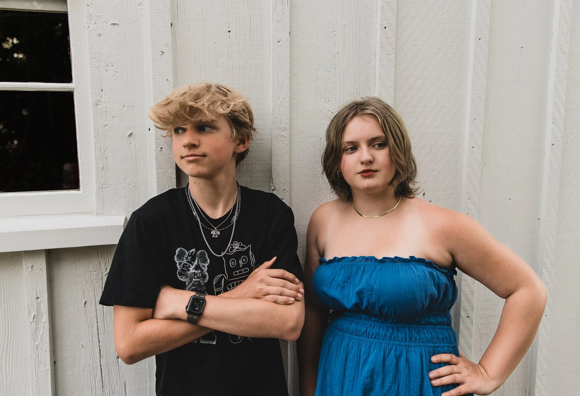 Siblings standing together not looking at camera with Richmond Family Photographer, at Britannia Shipyards.