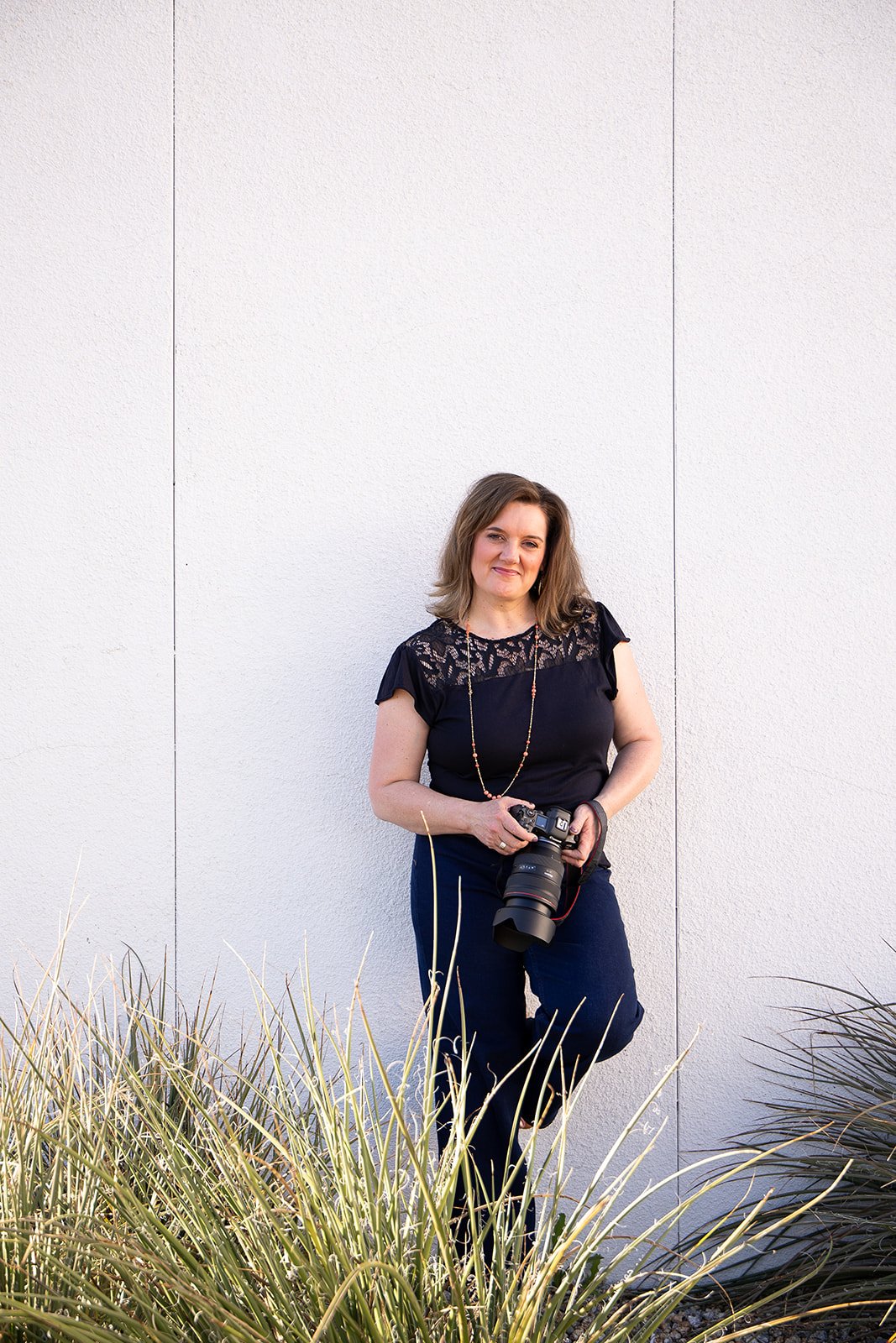 michelle baril standing with canon r5 camera