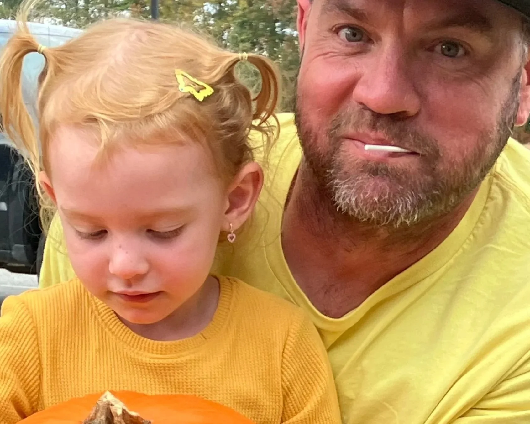 Dad and daughter with pumpkin