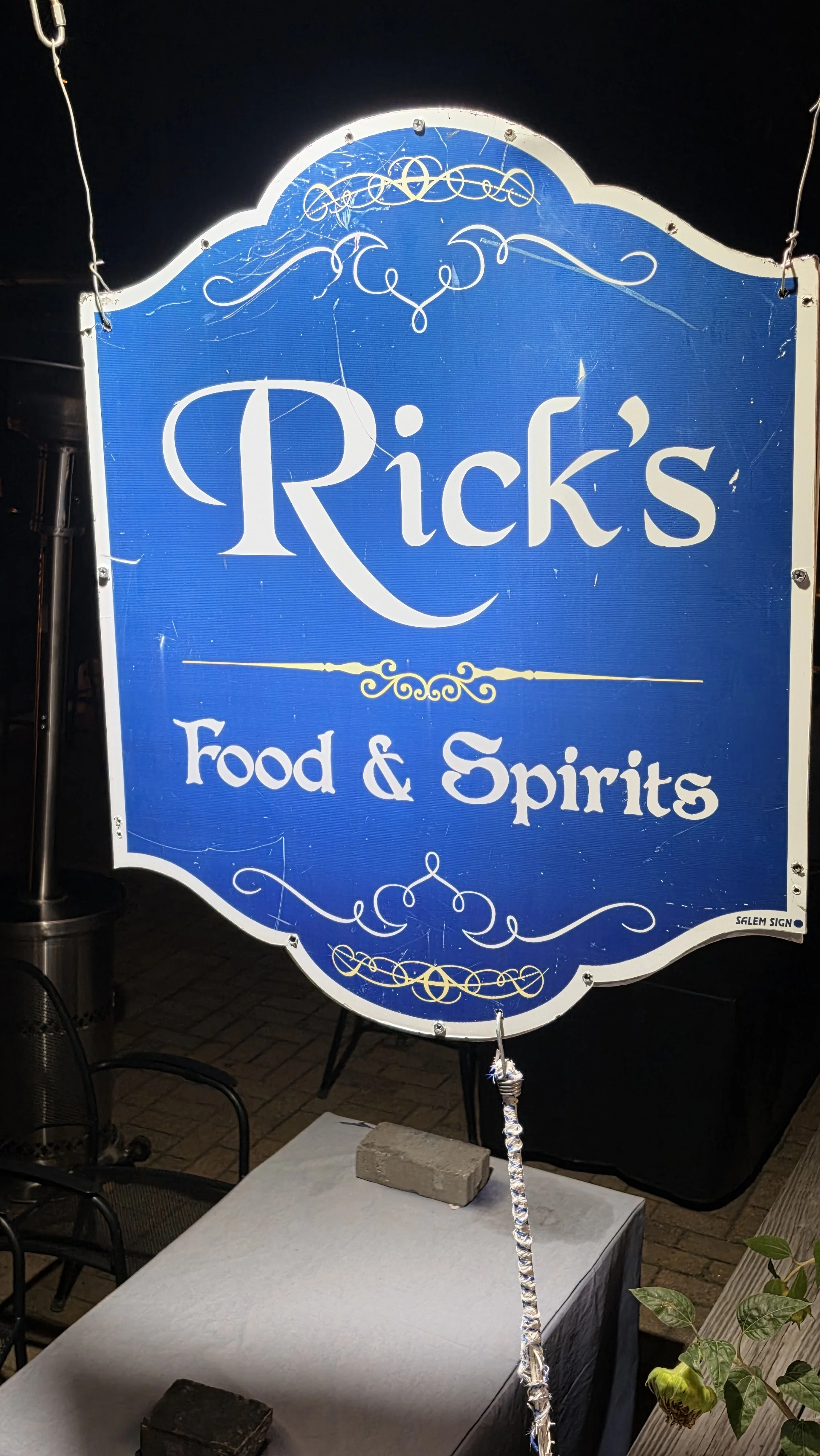 Rick's Food and Spirits sign