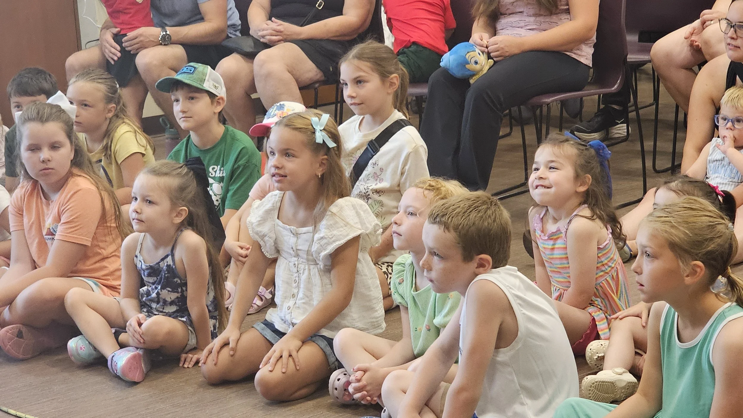 close up of some kids in Crowd at Magic Fred