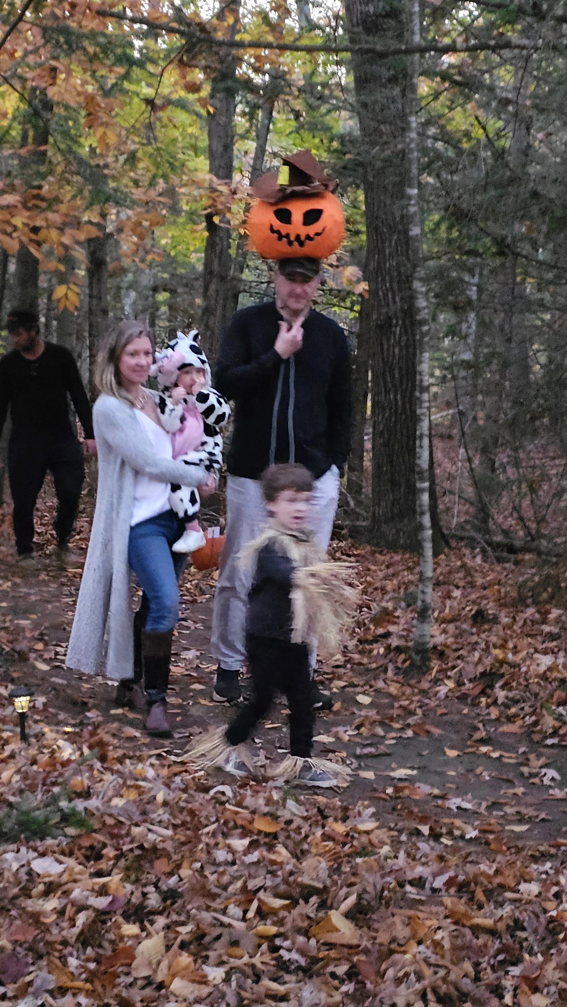 a family walking in the spooky woods