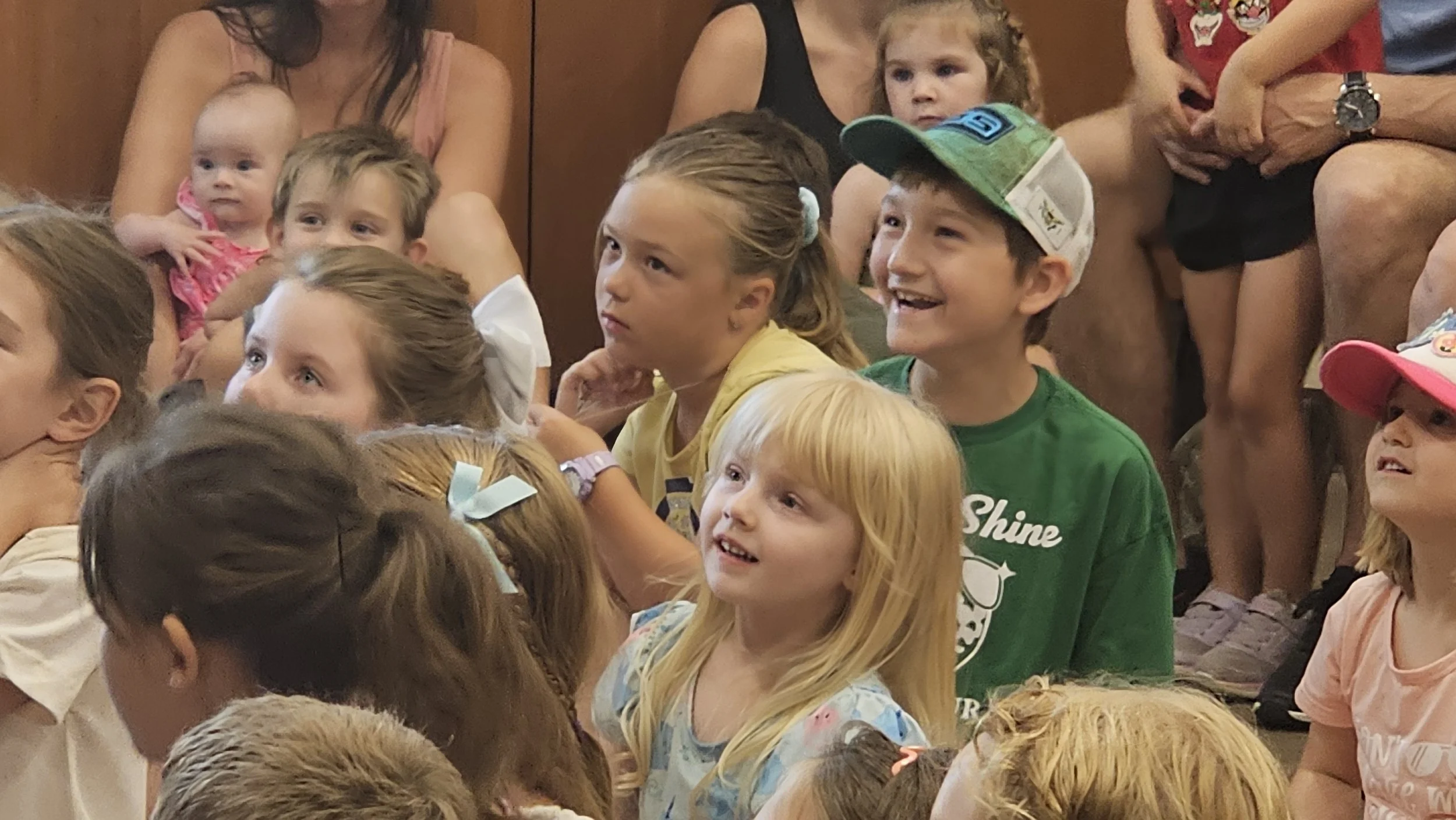 Close up of kids smiling at magic show