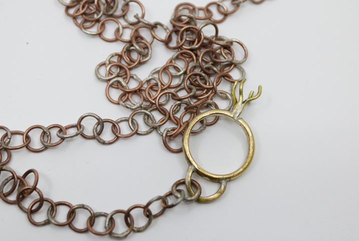 The Ordeal of Marriage (ring detail), 2025.  Brass and copper, 1 x 1 x 83 in