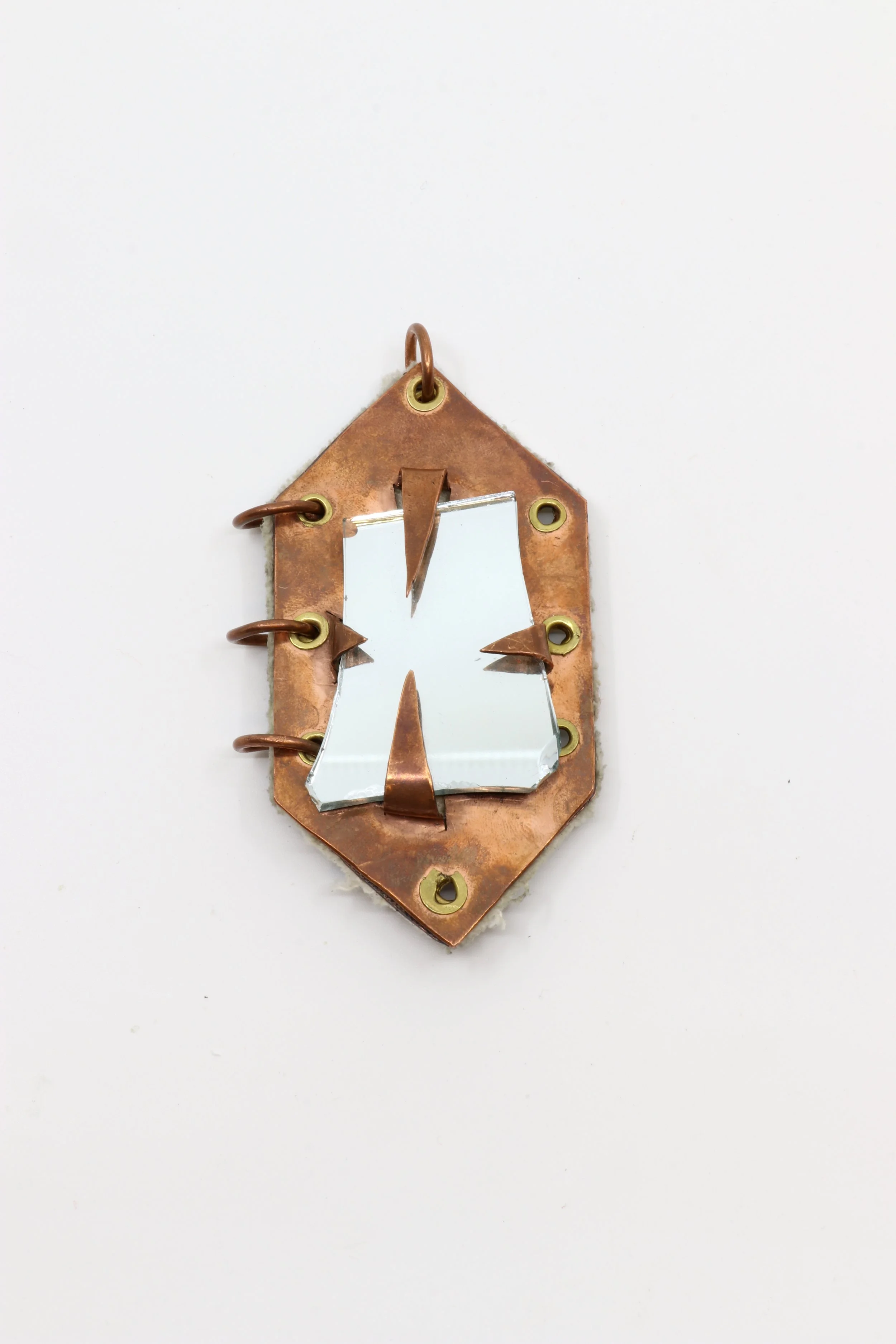Who you are, What I am (front view) 2025. Copper, brass, mirror shard, raw canvas,  4 x 2 x ¼ inches
