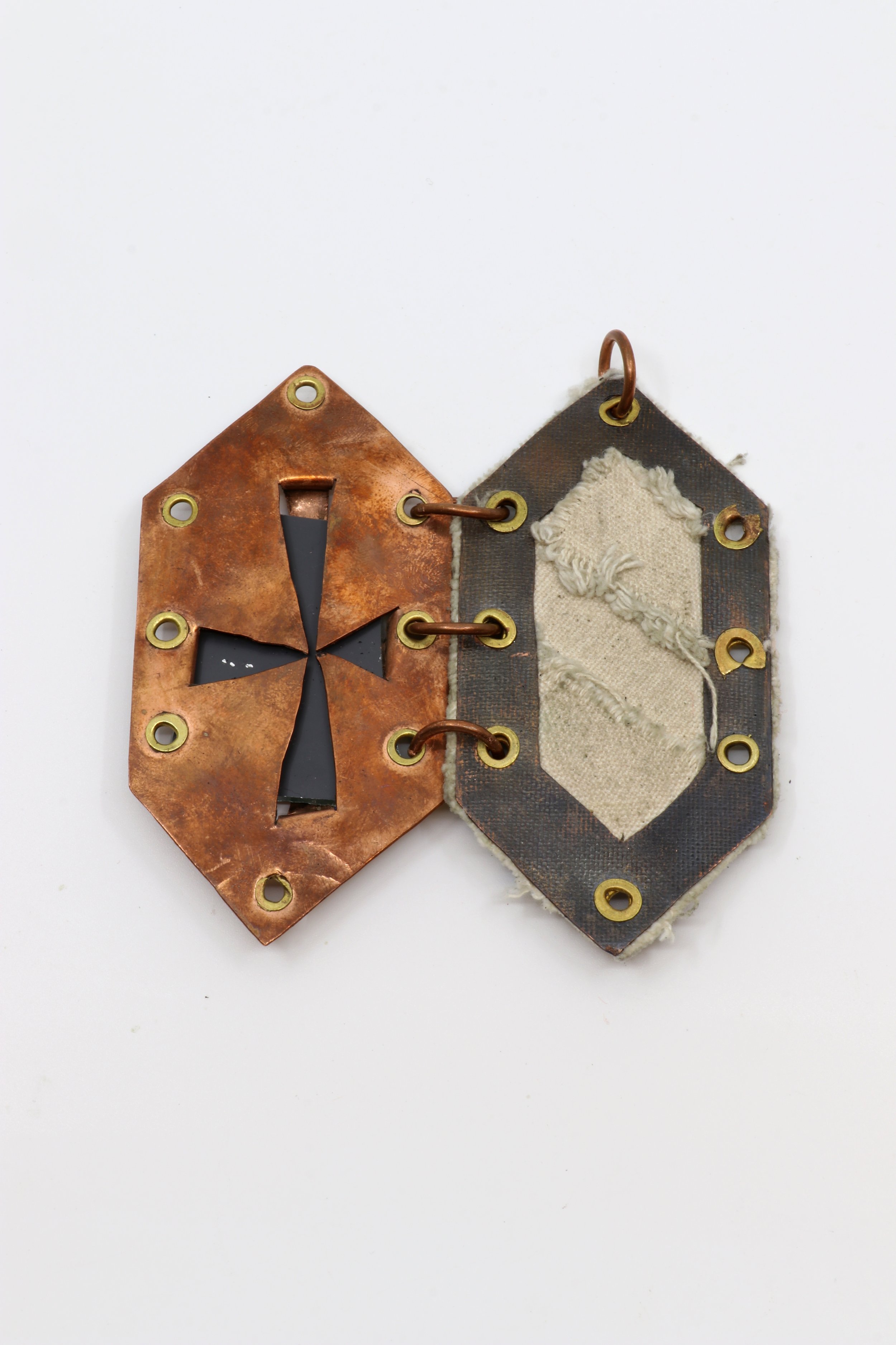 Who you are, What I am (inside view 2) 2025. Copper, brass, mirror shard, raw canvas,  4 x 2 x ¼ inches

