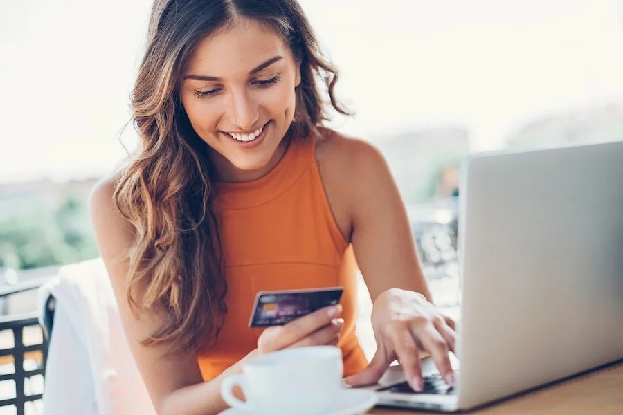 woman paying for dental coverage with the canadian dental care plan