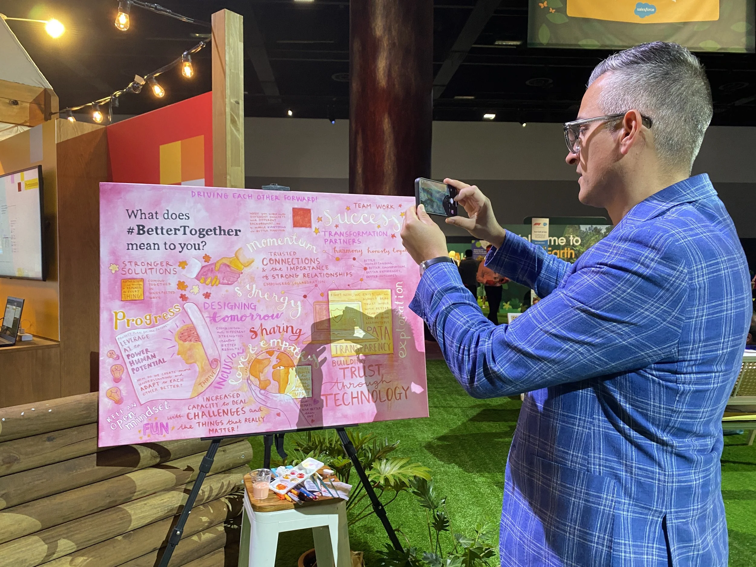 Man photographing Kate painting.JPG