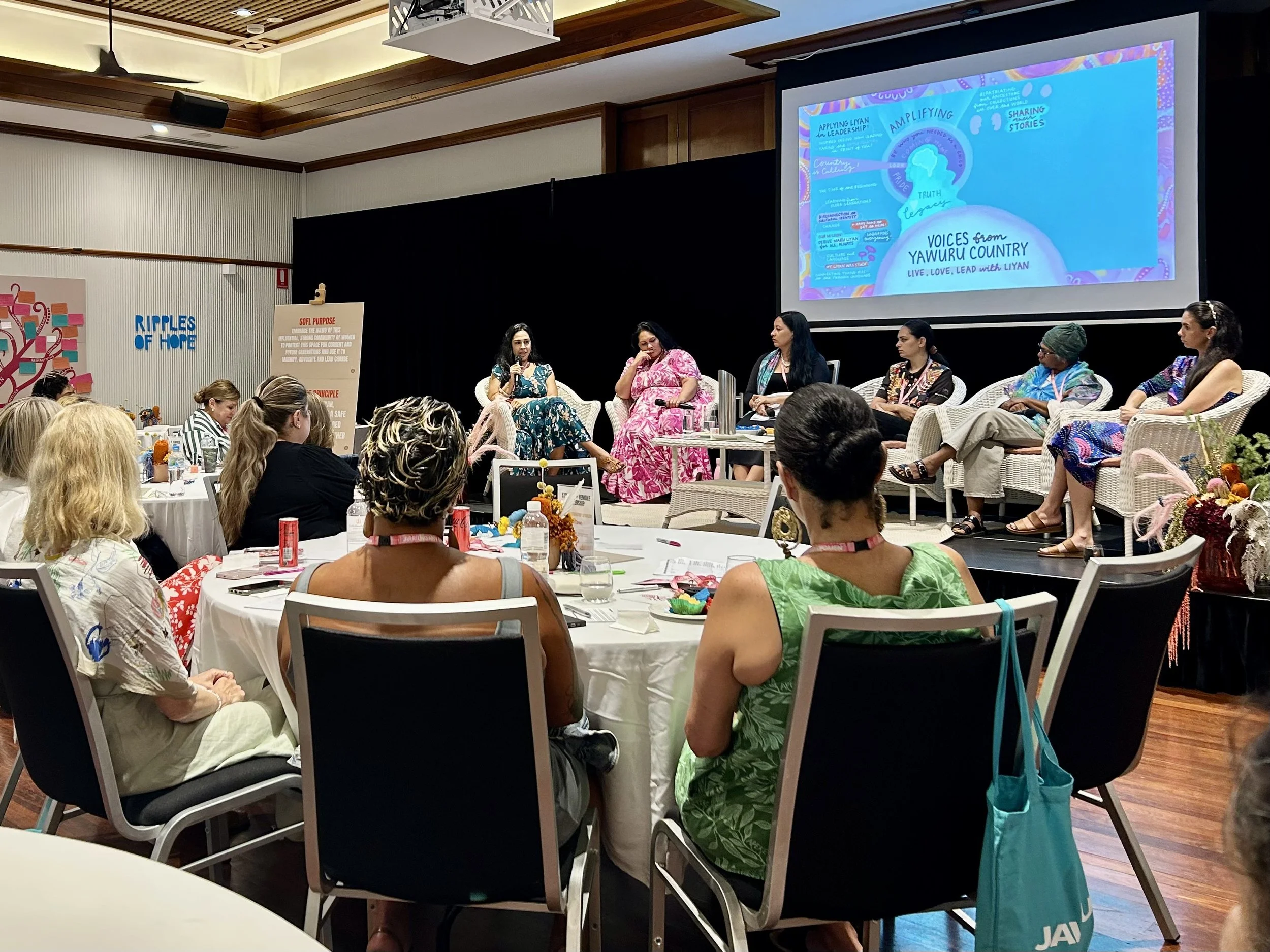 Graphic recording of panel discussion by Melbourne graphic recorder Kate Baxter, captured digitally on iPad and projected behind speakers