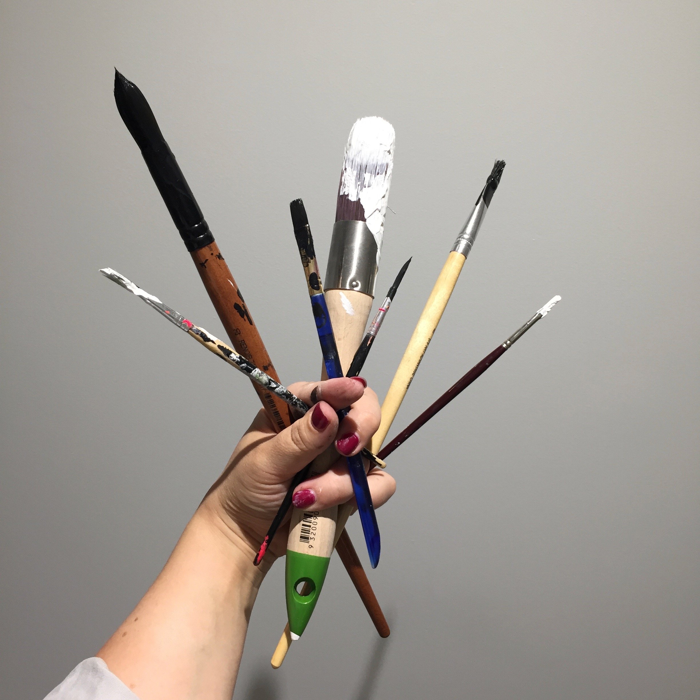 paintbrushes in hand.jpg