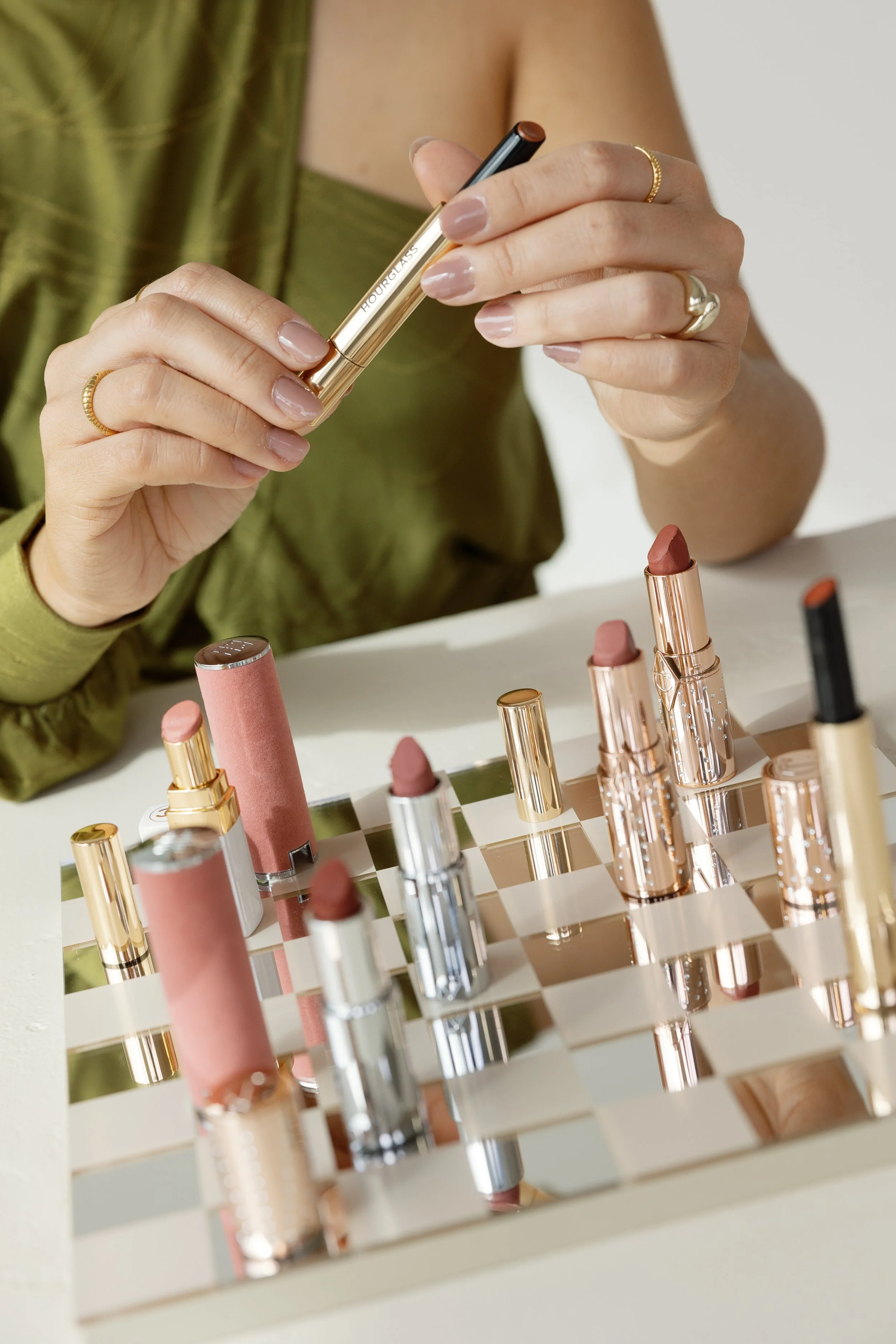 Indonesian wedding dessert table featuring colorful traditional sweets, tropical floral arrangements, and ambient lighting; wedding by Atelier Amarise. Styled by Fear the Feast.