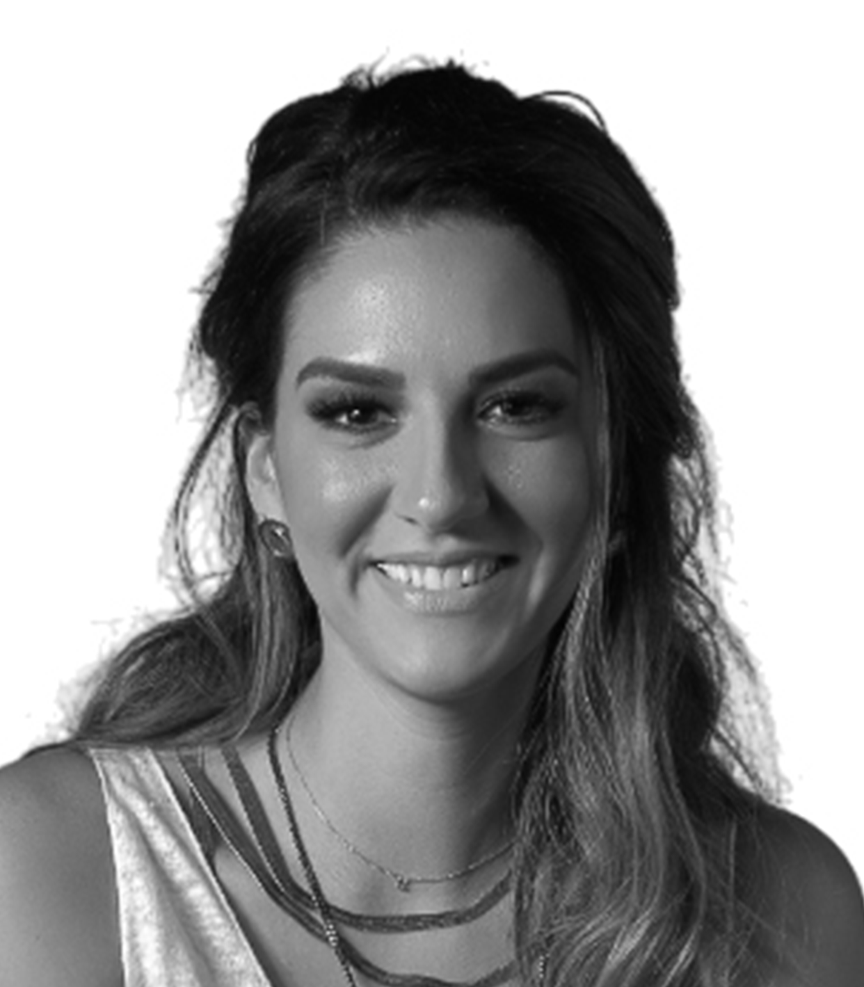 Black and white portrait of a smiling woman with dark hair, wearing layered necklaces and a sleeveless top.