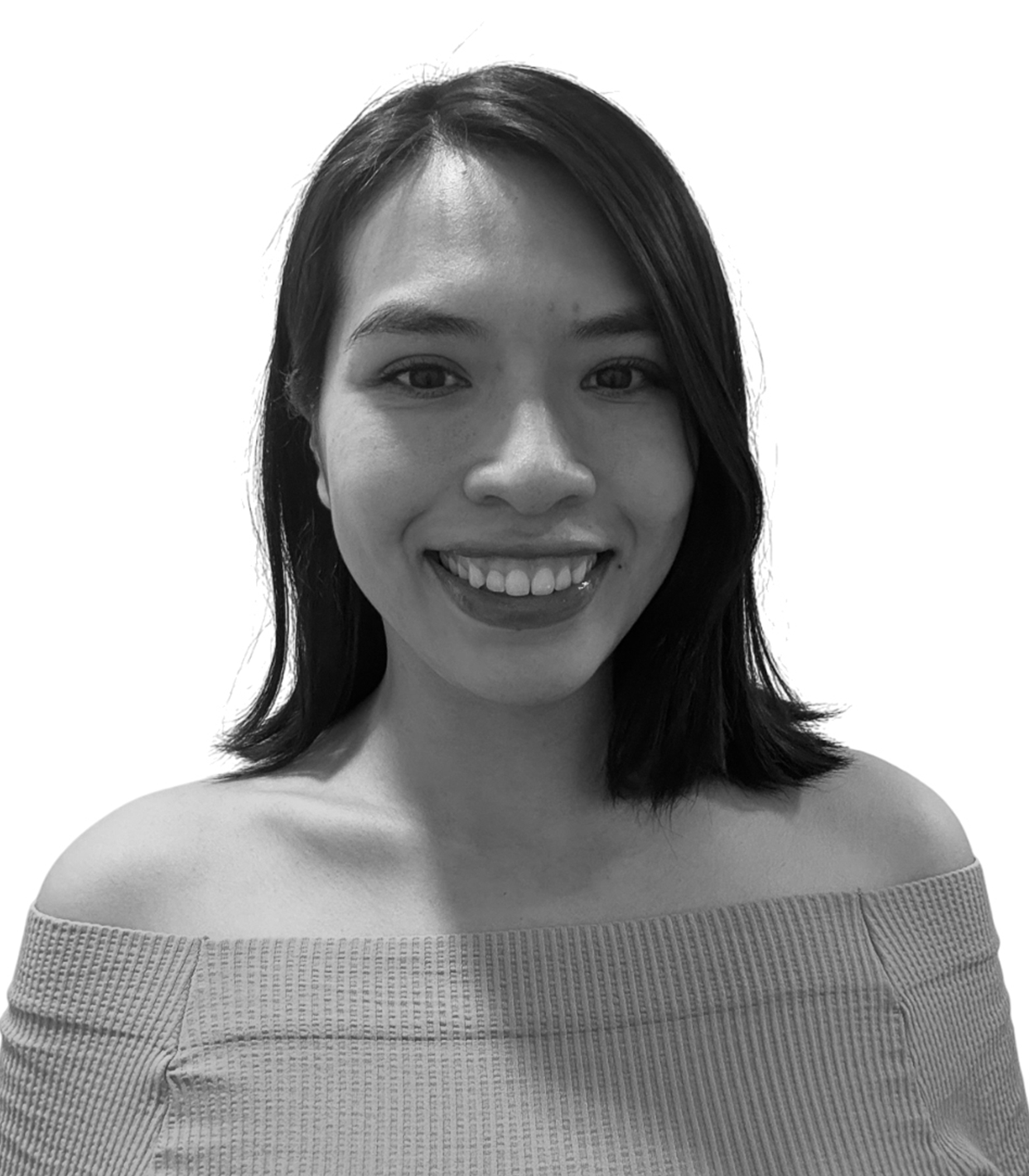 A smiling young woman with shoulder-length dark hair, wearing an off-the-shoulder top, in black and white.