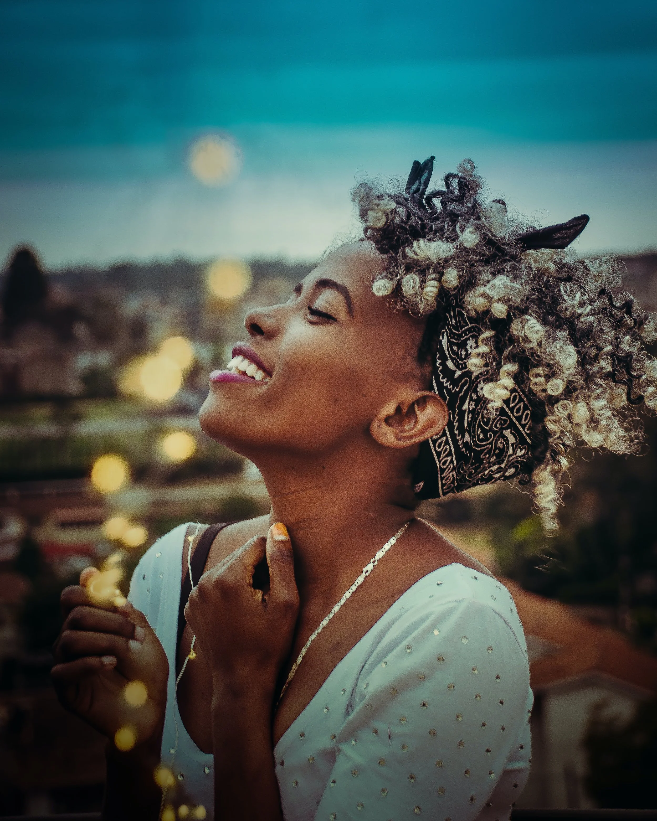 Woman looking up at the sky, feeling relieved and at ease after therapy