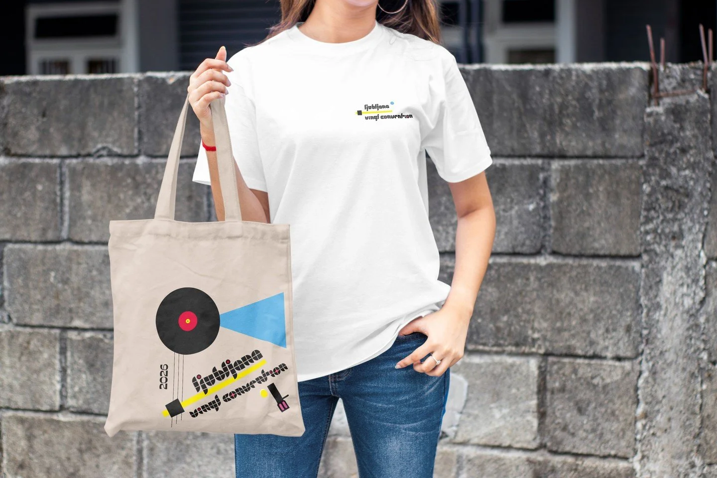 When the visual identity becomes a tote bag for records. And a t-shirt. And then someone's whole fit! 💪

For Ljubljana Vinyl Convention 2026 I also designed the merch&mdash;vinyl tote bags and tees that carried the same Bauhaus-turntable energy as t