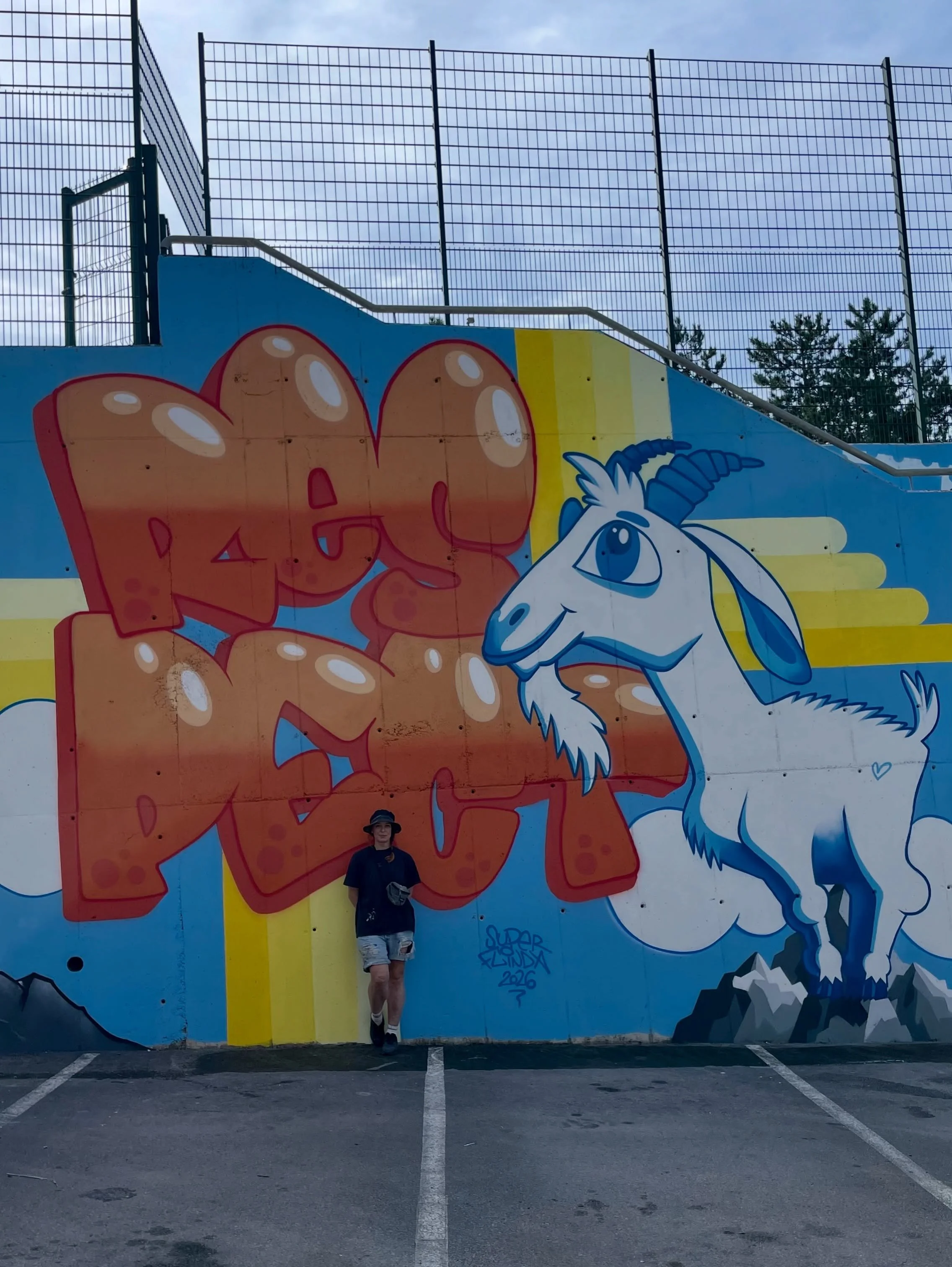 🐐 Respect G.O.A.T. ~40 m&sup2; mural, spray paint and acrylics on facade, Primary School Du&scaron;an Bordon, Semedela, Koper, Slovenia, 2026.

My artwork for Street Art Festival Koper 2026. The theme of our joint public school mural was mutual resp