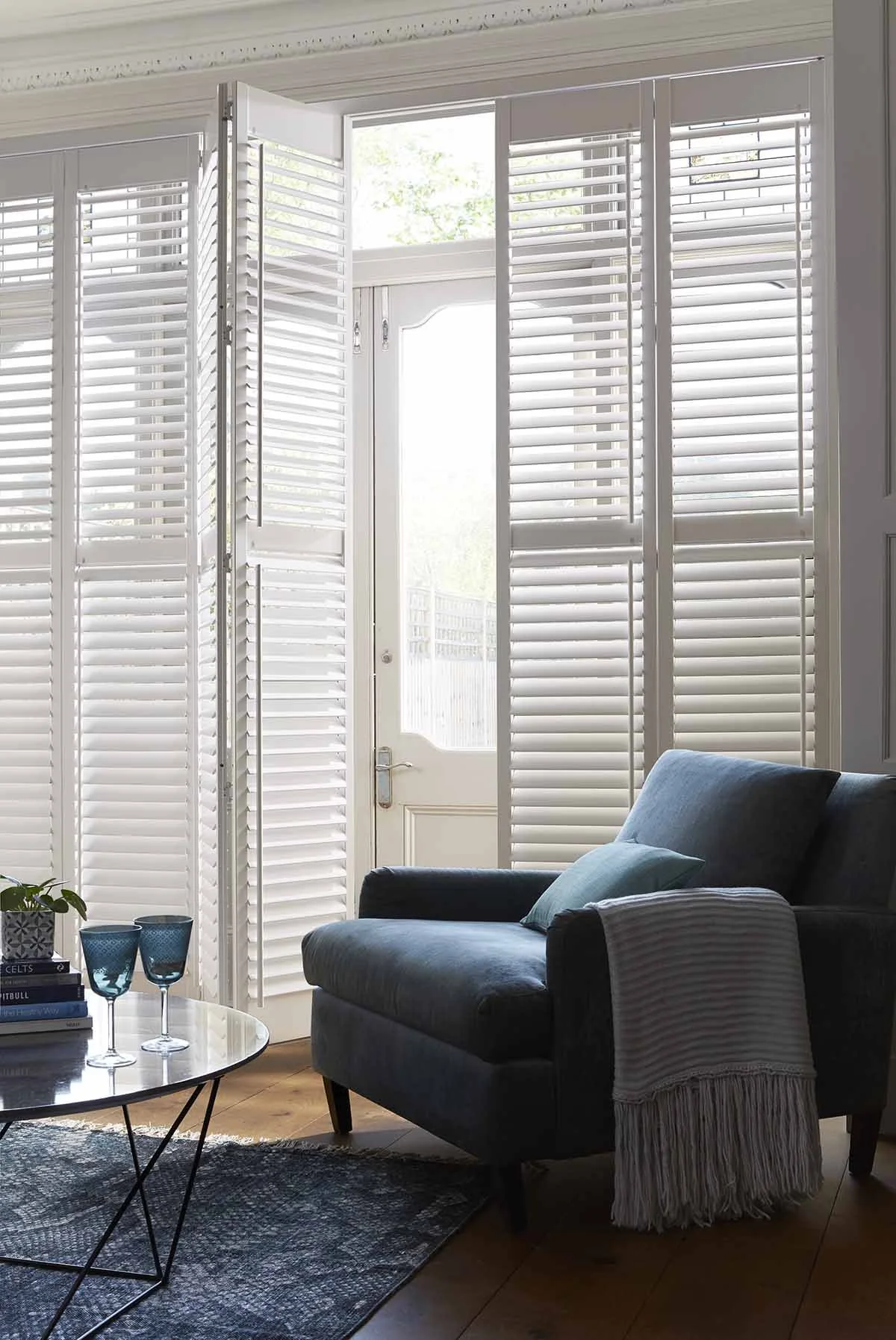 Living room shutters installed on patio doors