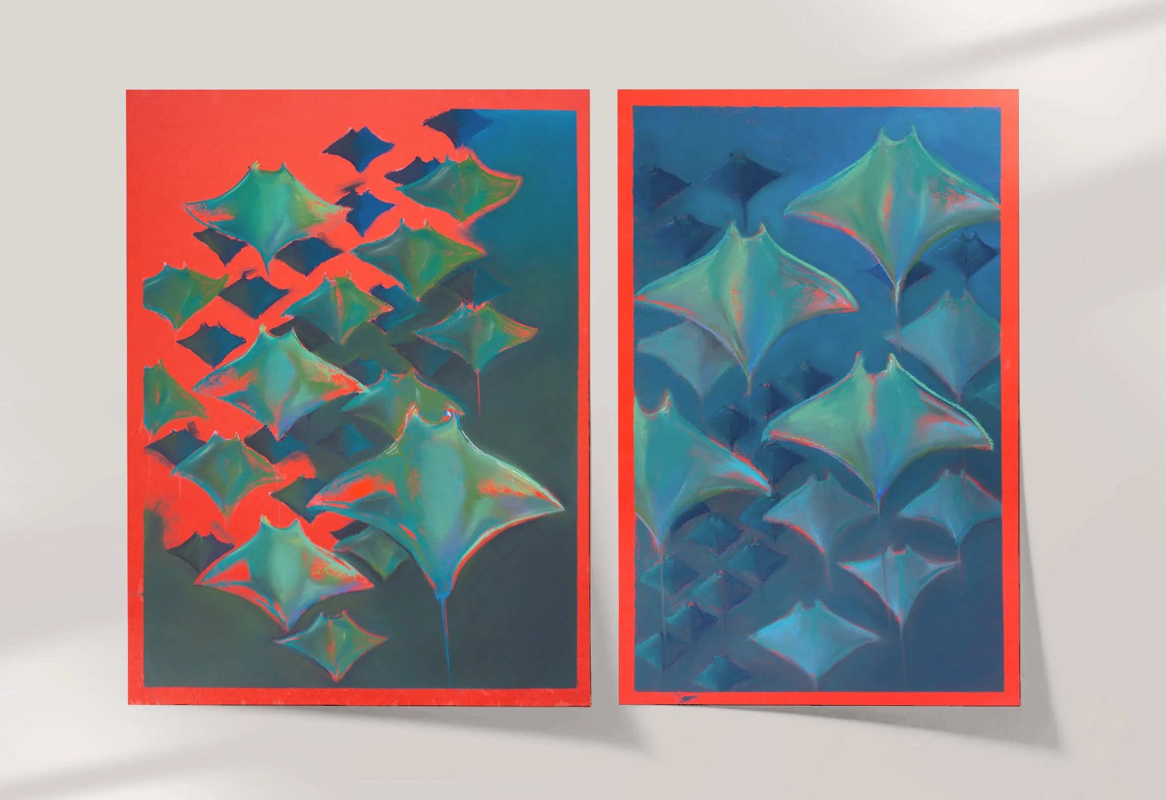 Two colorful abstract paintings featuring a series of diamond-shaped forms with curved edges, rendered in vibrant blues, greens, and hints of red, each framed with a red border, mounted on a white wall.