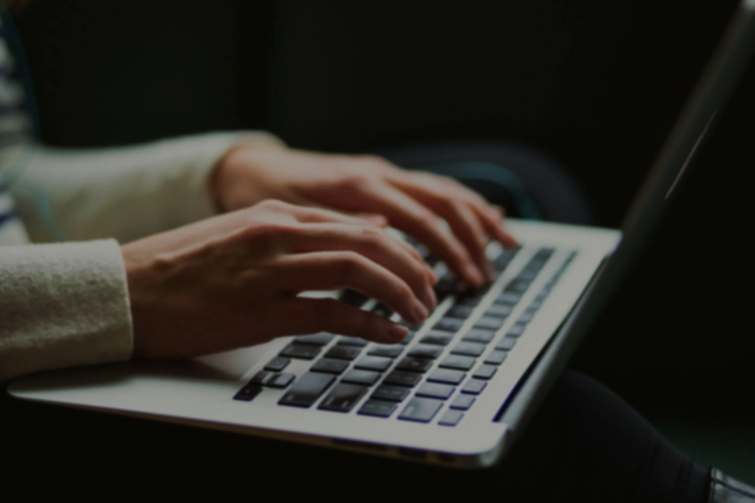 Image of individual typing on keyboard