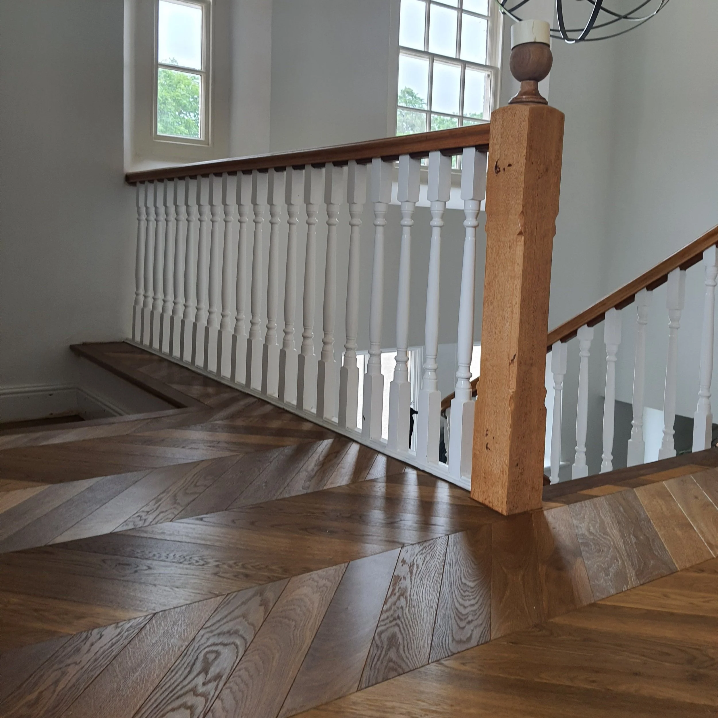 Dark chevron mix installed in a hallway