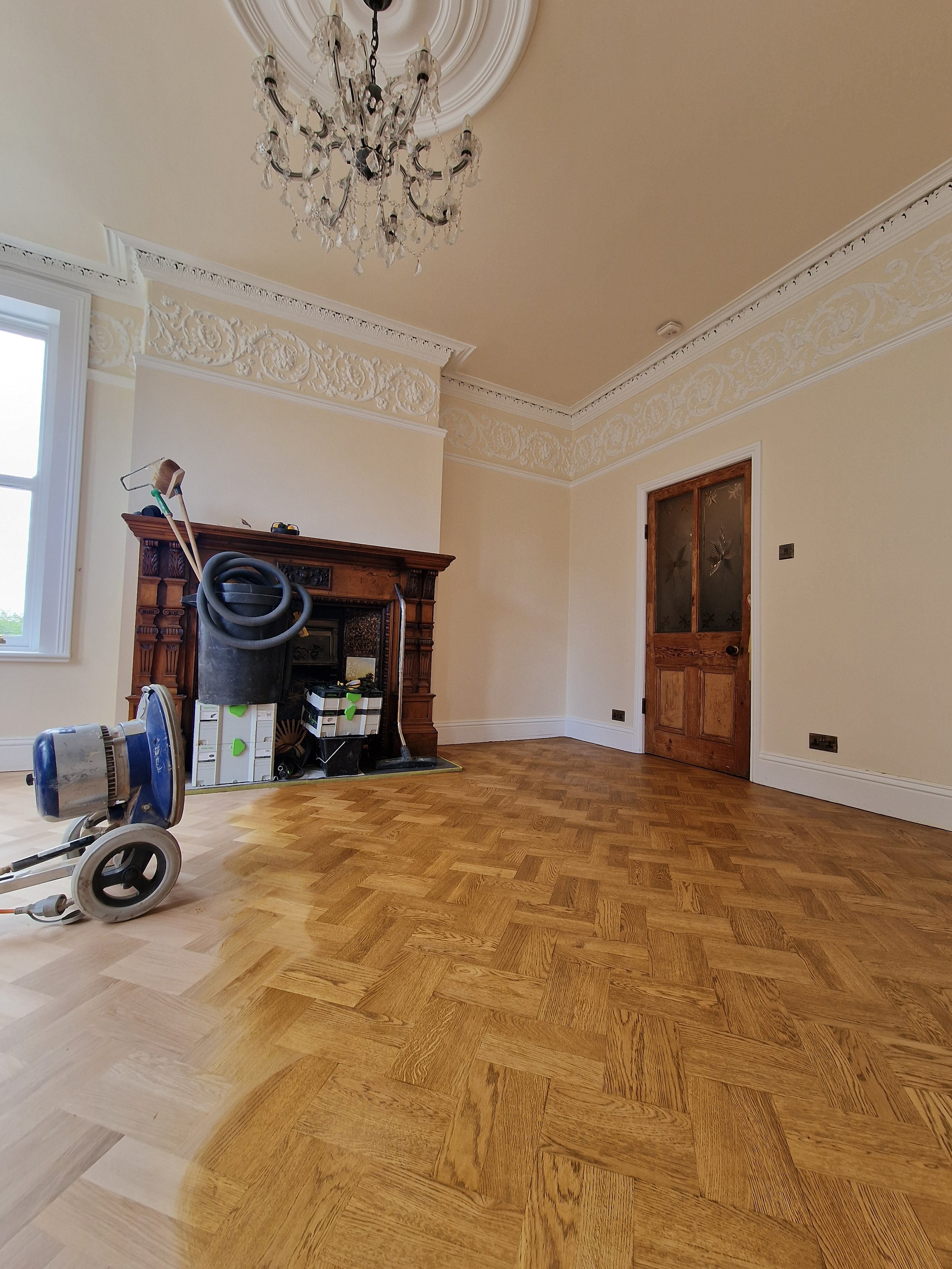 Unfinished parquet being stained